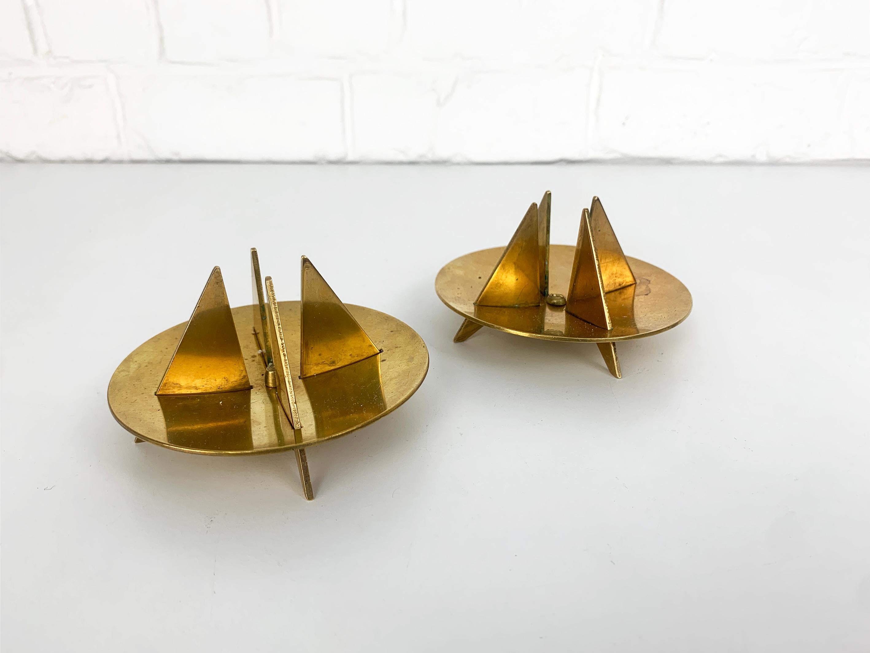 A pair of candle-sticks made of solid brass. Model Nr.20 created by Pierre Forssell. 

Designed by Pierre Forssell and manufactured in Sweden by Skultuna. The company was founded by King Carl IX of Sweden in 1607. Pierre Forsell worked between 1955
