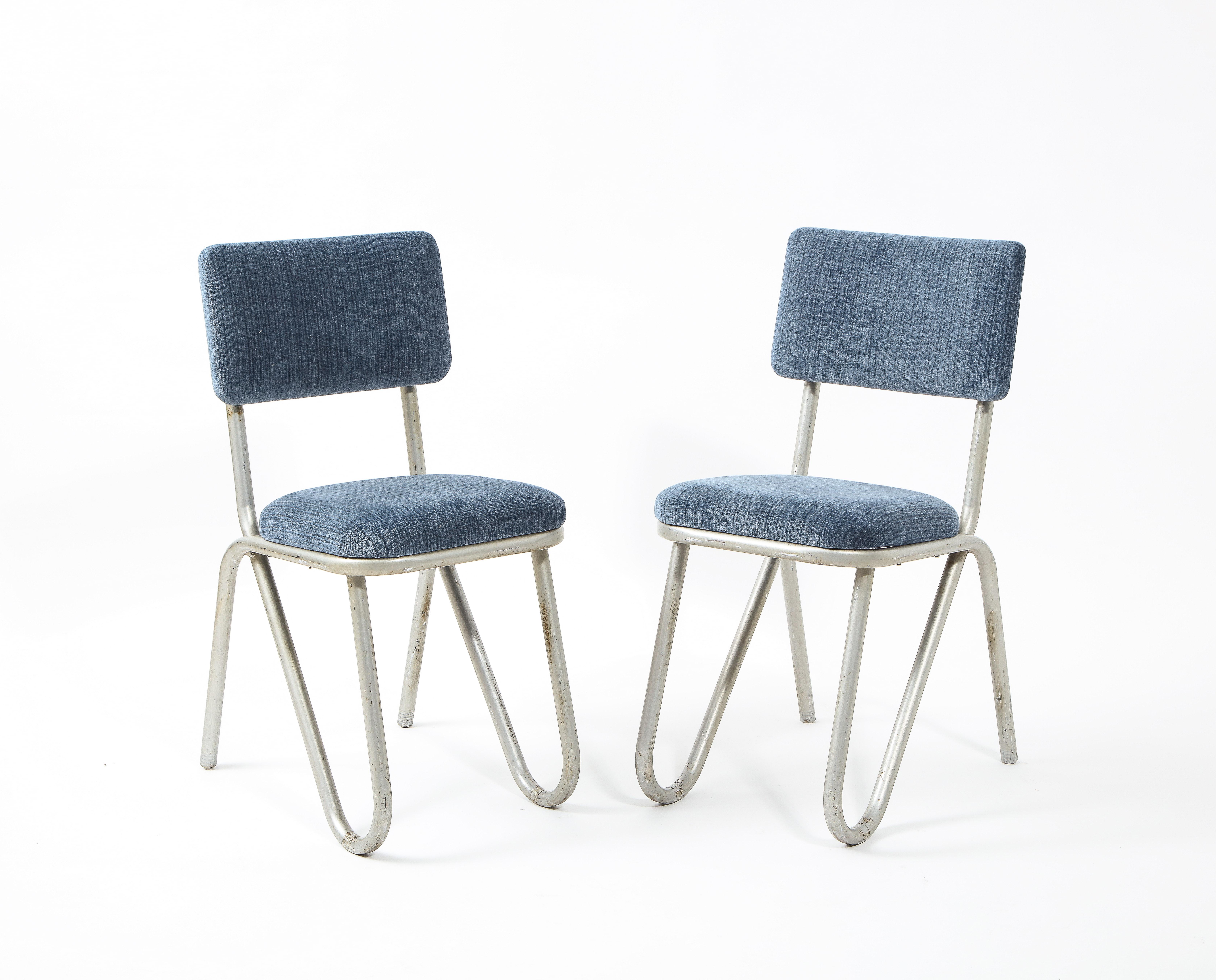 A pair of modernist chairs reminiscent of the 