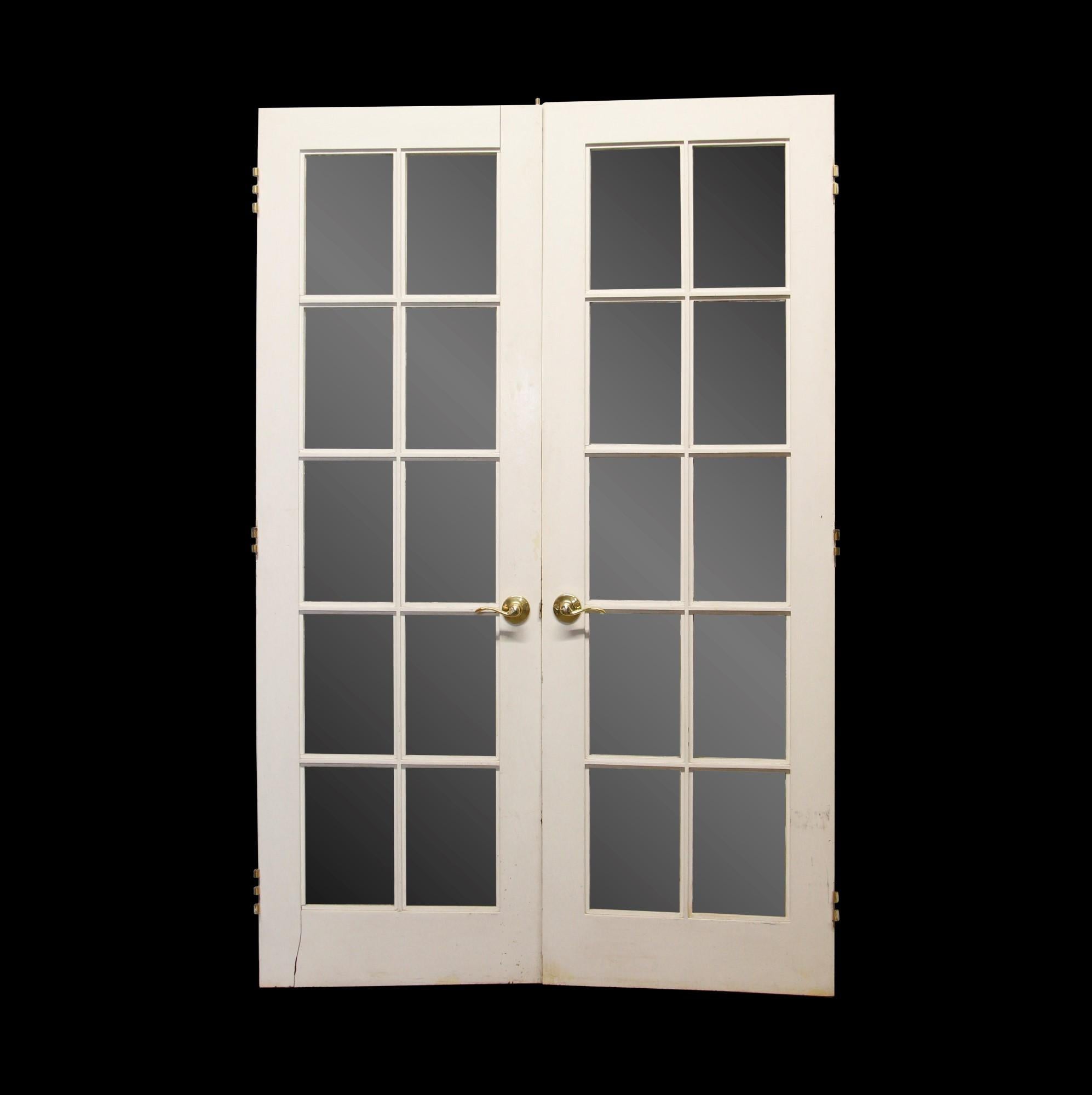 20th Century pair of white painted wooden French doors with 10 lites each. Minor structural damages. Please see the photos. Priced as a pair. This can be seen at our 400 Gilligan St location in Scranton. PA.