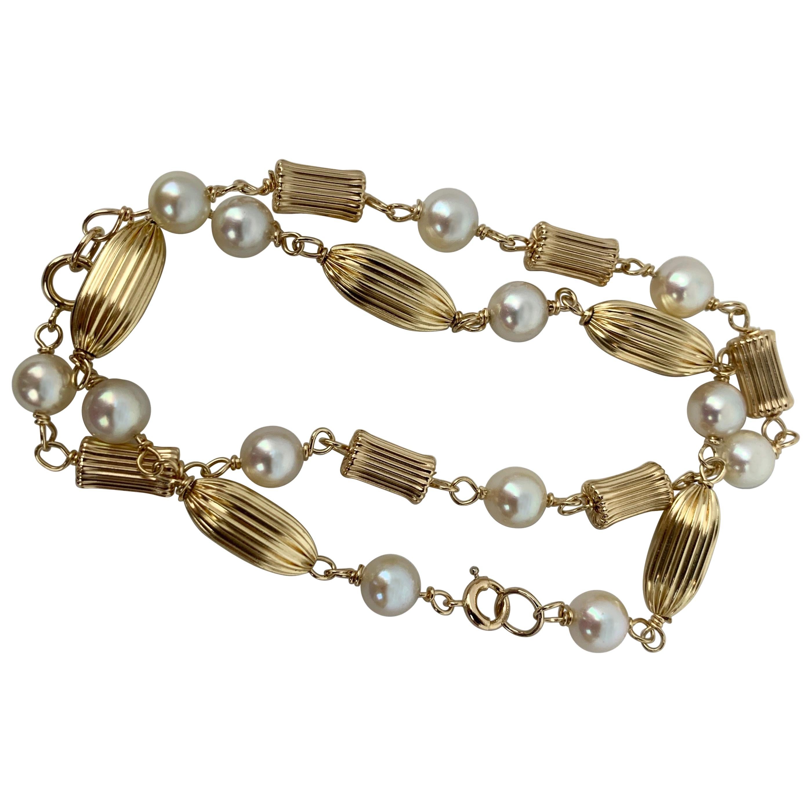  Pair of Pearl and Fluted 14K Yellow Gold Bead Bracelets 