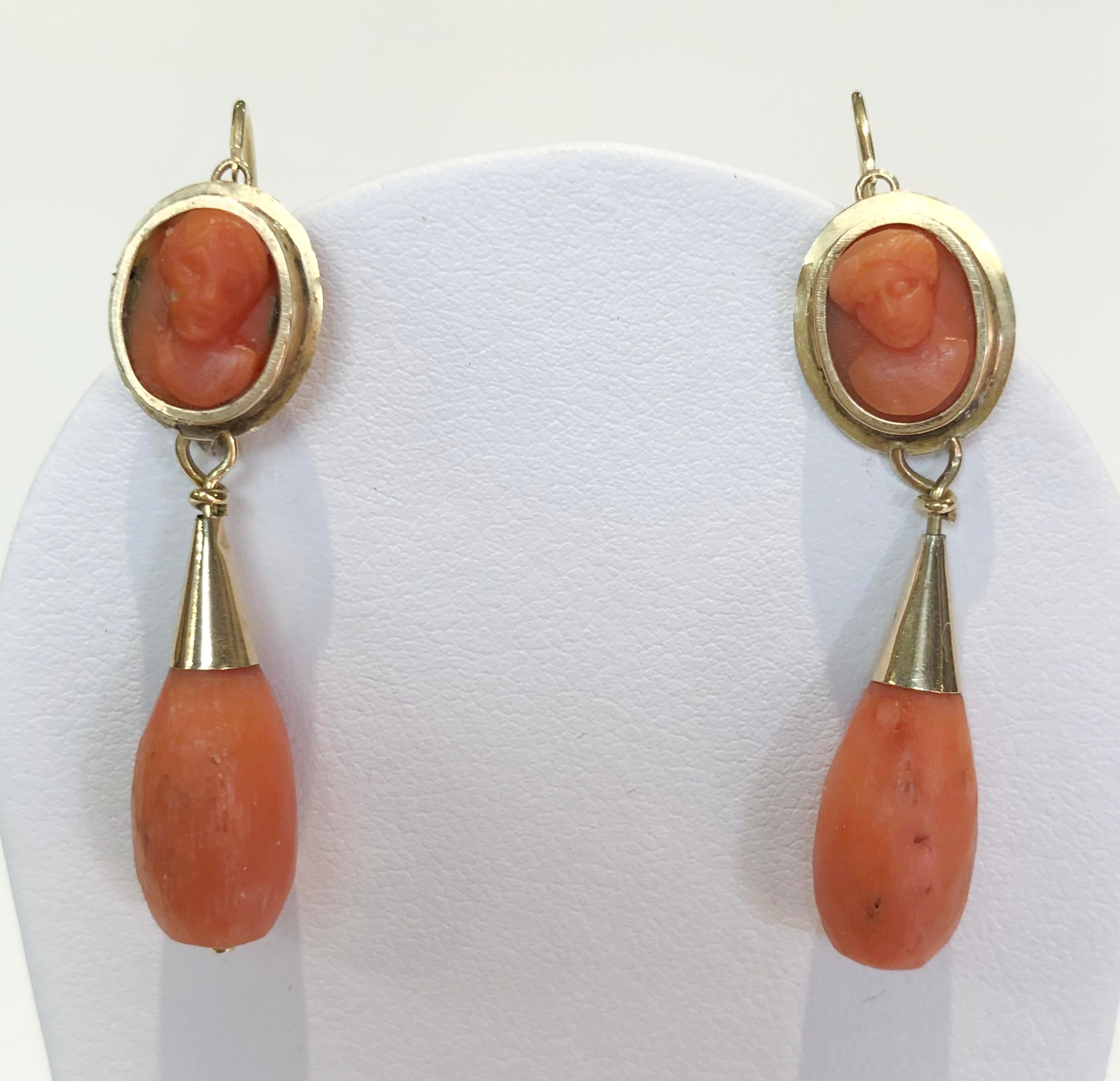 Pair of 14 karat gold earrings with red coral cameos and drops, Italy 1800s
Length 4.5 cm