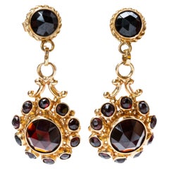Pair of 14 Karat Gold Earrings with an Entourage of Natural Garnet