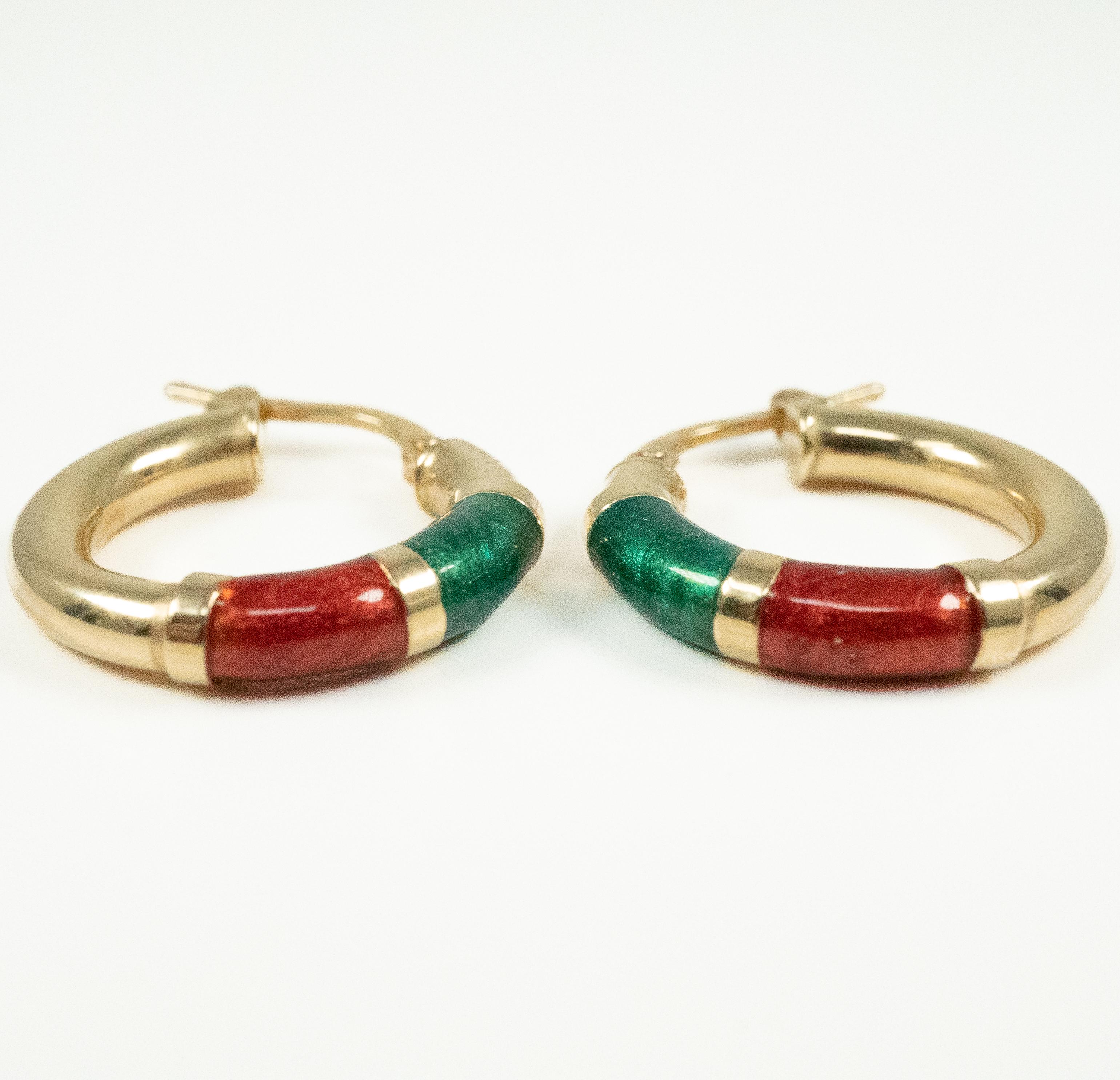 So light and comfy on the ear!  In 14 karat yellow gold with reddish and blue-green enamel accents.   