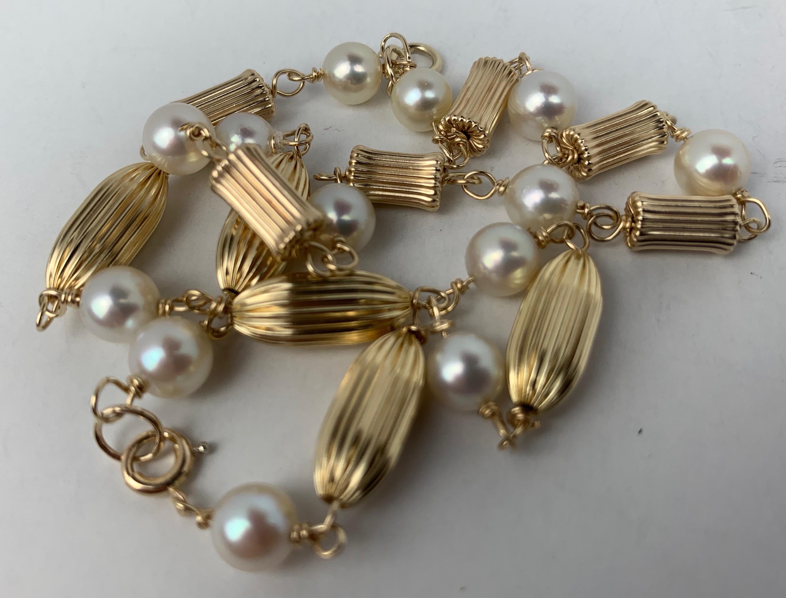 Contemporary  Pair of Pearl and Fluted 14K Yellow Gold Bead Bracelets 