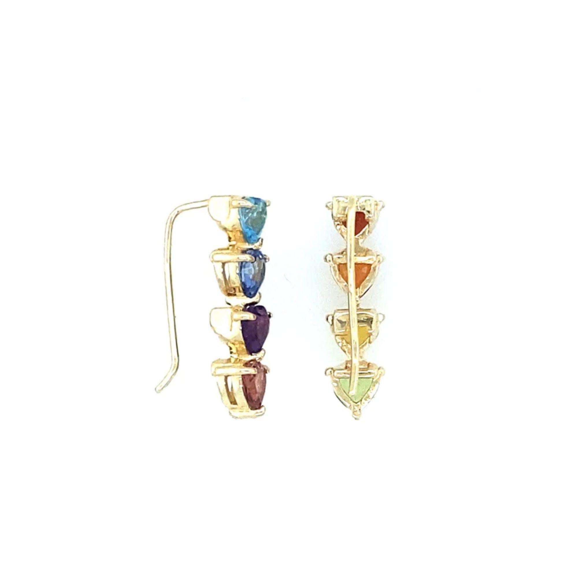 Drip in the full rainbow fantasy in the most unique and colorful ears climbers to light up your ears. These climbers are like no other and consists of heart settings with colored gems and sapphires in the classic Mordekai rainbow pattern. Can be