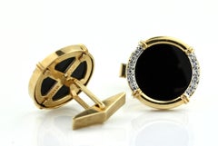 Pair of 14kt Yellow Gold, Onyx and Diamond Cufflinks
