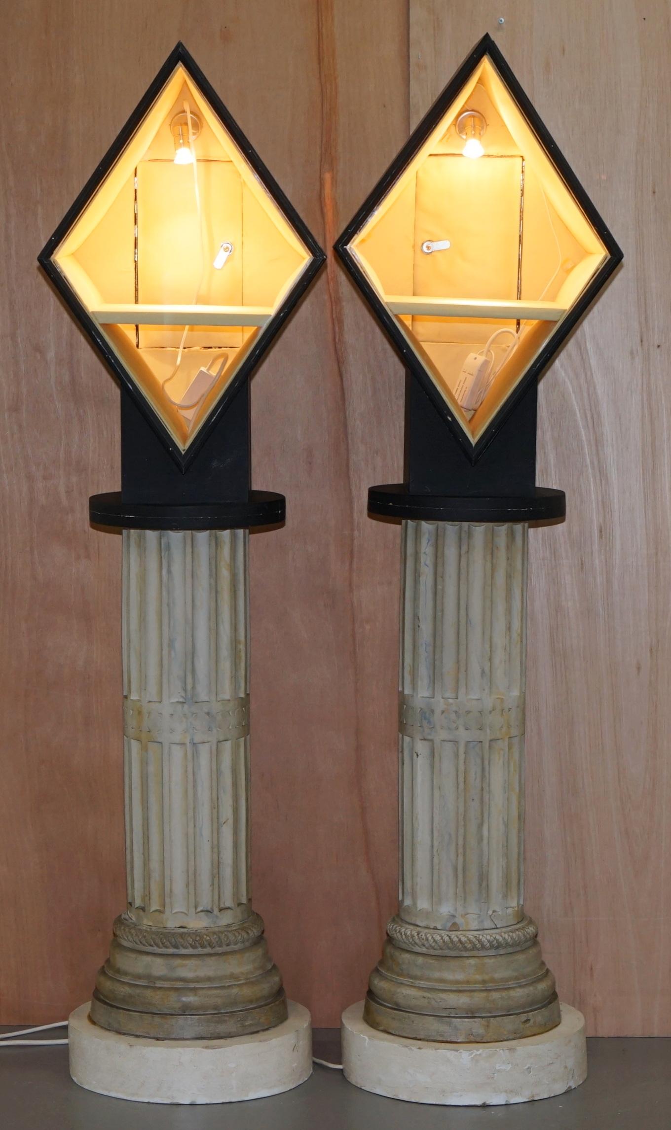 We are delighted to offer for sale this stunning of 170cm tall display pillars with lights on Corinthian pillar bases

A very good looking and decorative pair, the cabinets have been PAT tested and rewired as needed, I have a pack of new bulbs