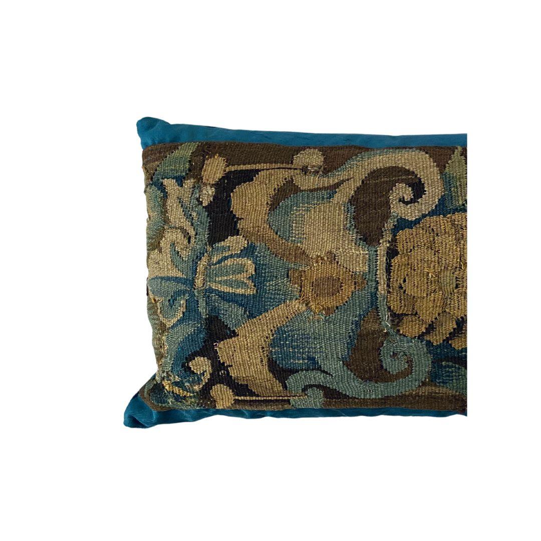 A beautiful pair of Aubusson 17th century blue cushions lined with roman velvet in a matching blue and filled with duck feathers. These come as a set of 2.