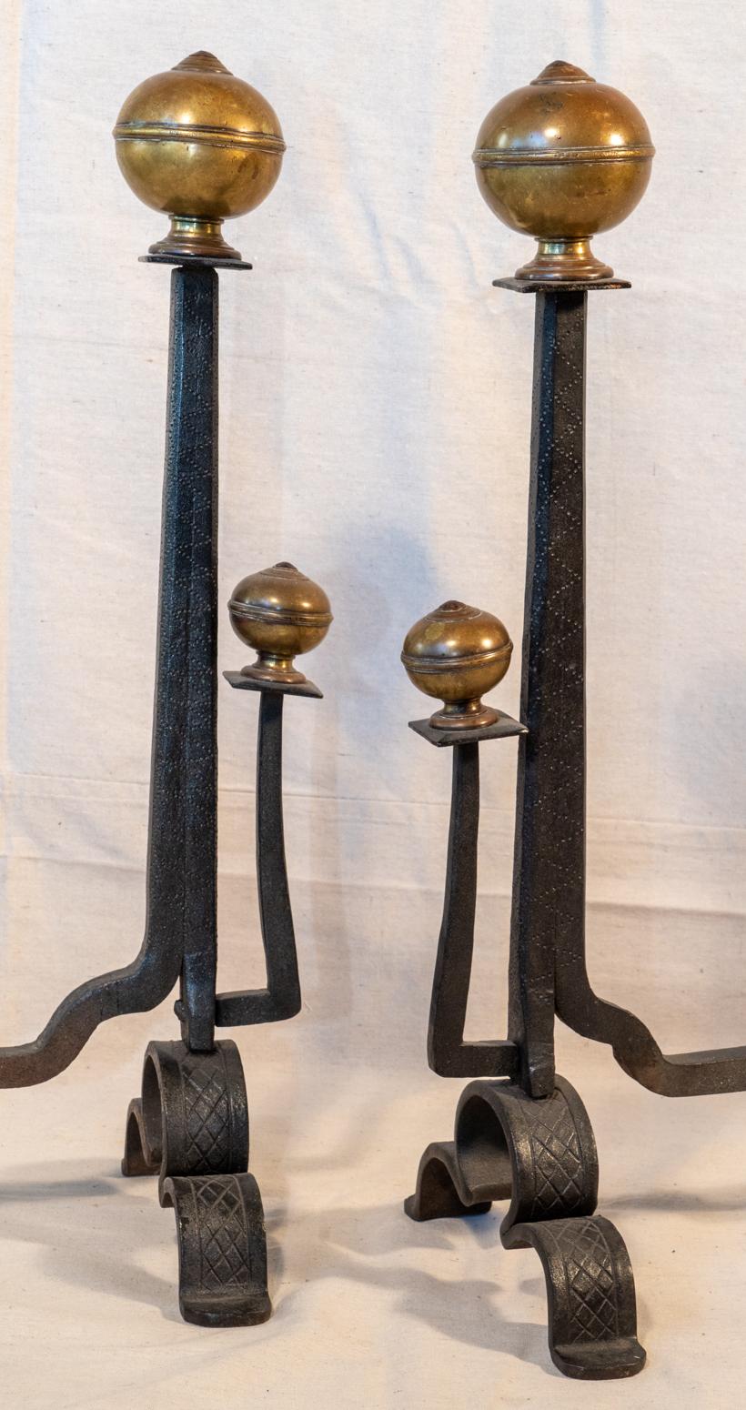Pair of 17th century style iron and brass handwrought Andirons, circa 1880
The later manufacture, all by hand, in the early Arts & Crafts period.
All handwrought of continuous form on the bases and uprights from a single worked piece. Cast brass