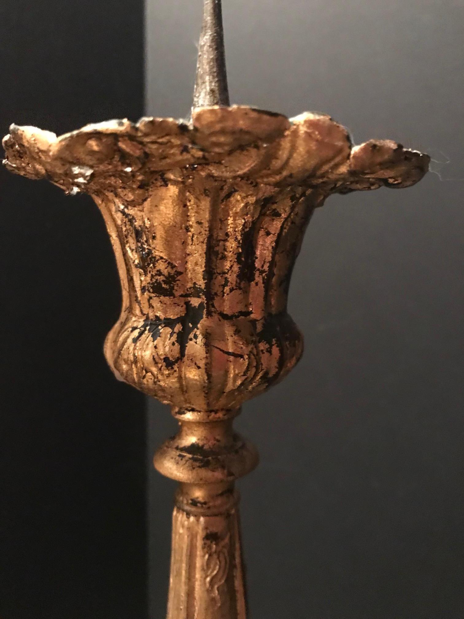 This pair of matching pricket candlesticks dates from the 17th century.
They are beautiful embossed with foliate and scroll motives. Age and
extensive use made a later regilding necessary. The bobeches show
some age related wear with a few breaks