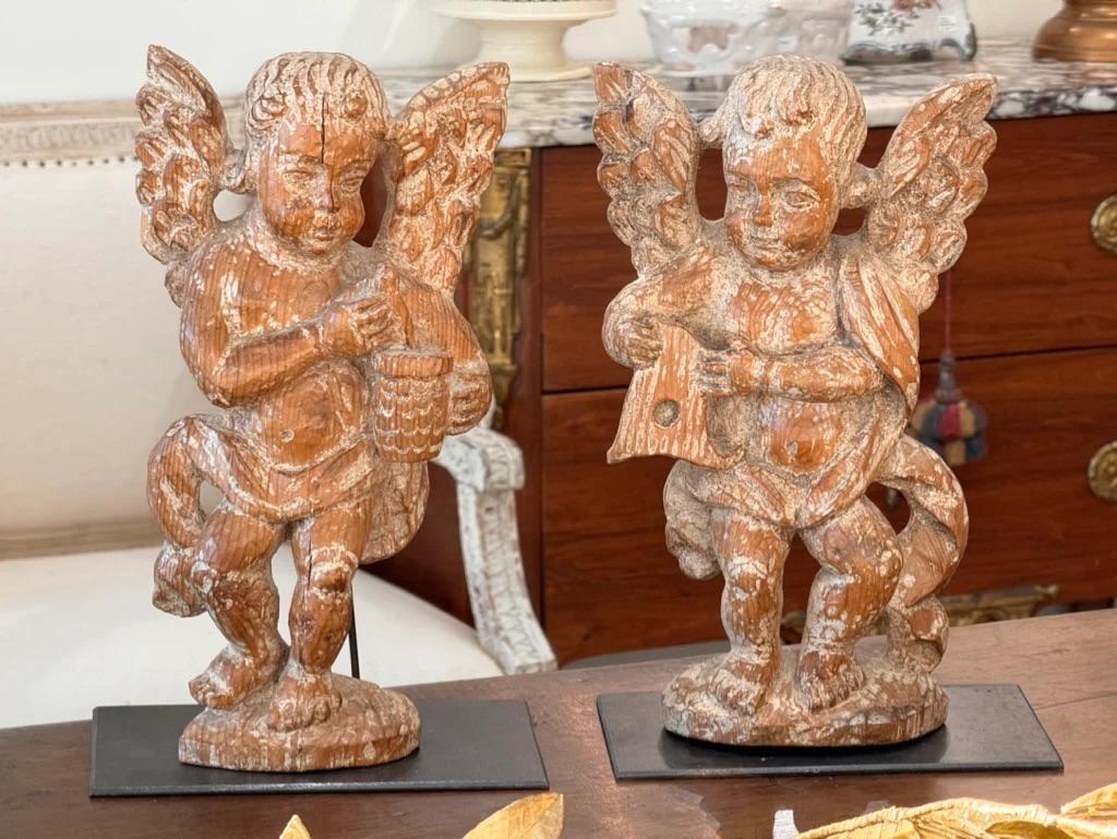 Pair ofSeventeenth Century French carved putti on stands.  Charming and beautifully detailed.  Found in Provence. 13.25” h. x 8” w x 2” d. The stand base: 8 5/8 x 4 ¾

