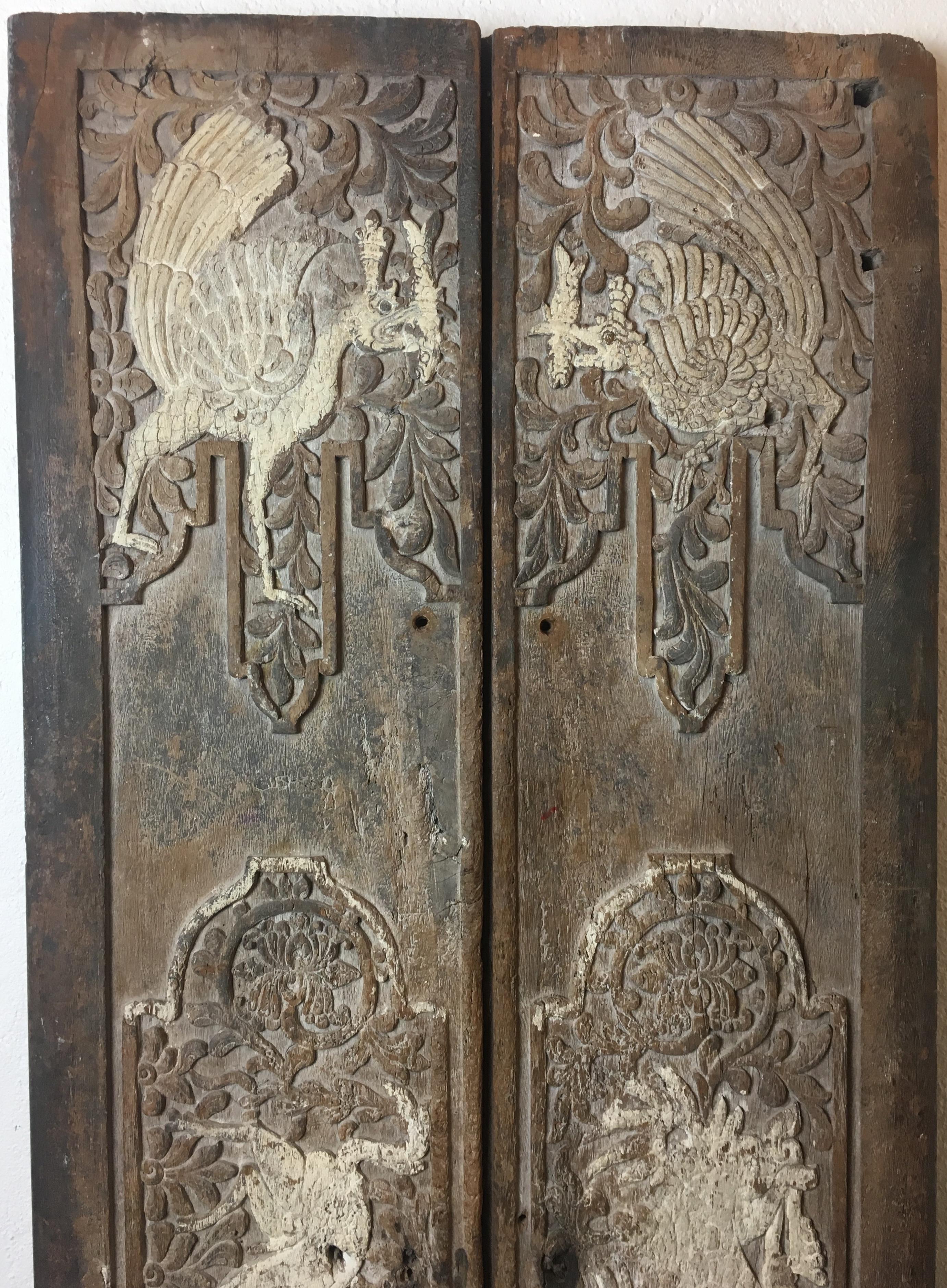 Antique Chinese architectural hand-carved doors or decorative wall panels from the 17th Century in completely organic form, original condition. These doors have a remarkable patina and are very decorative. 

The hand carvings in high relief and