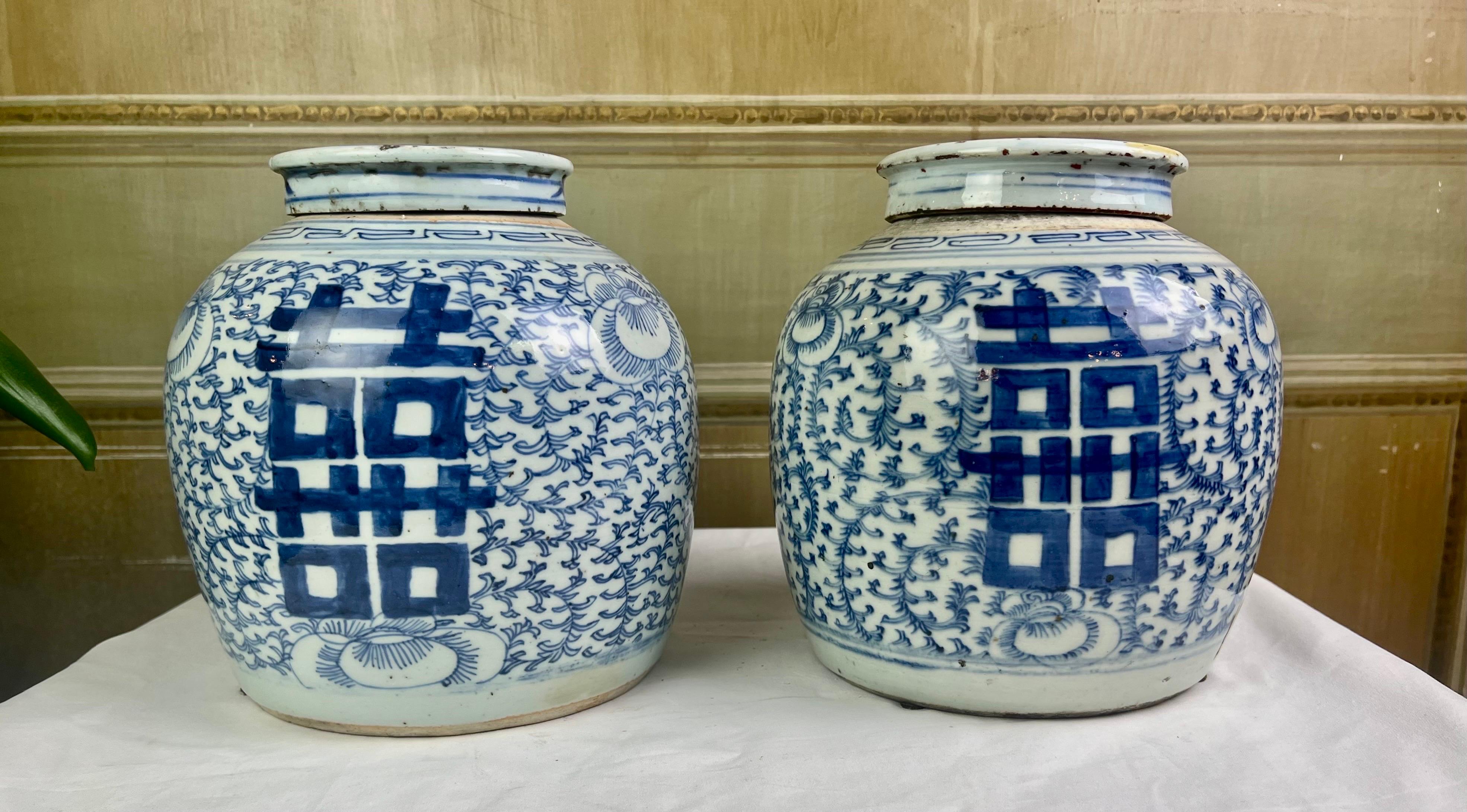 Blue and white Chinese Export ginger jars with lids.  Hand painted with the double happiness symbol.  Framed with a floral motif in cobalt blue
The heavier weight of these jars denotes their age.  Beautiful condition


 