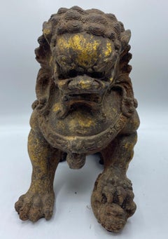 Pair of 17th Century Chinese Gilt Cast Iron Foo Dog Statues