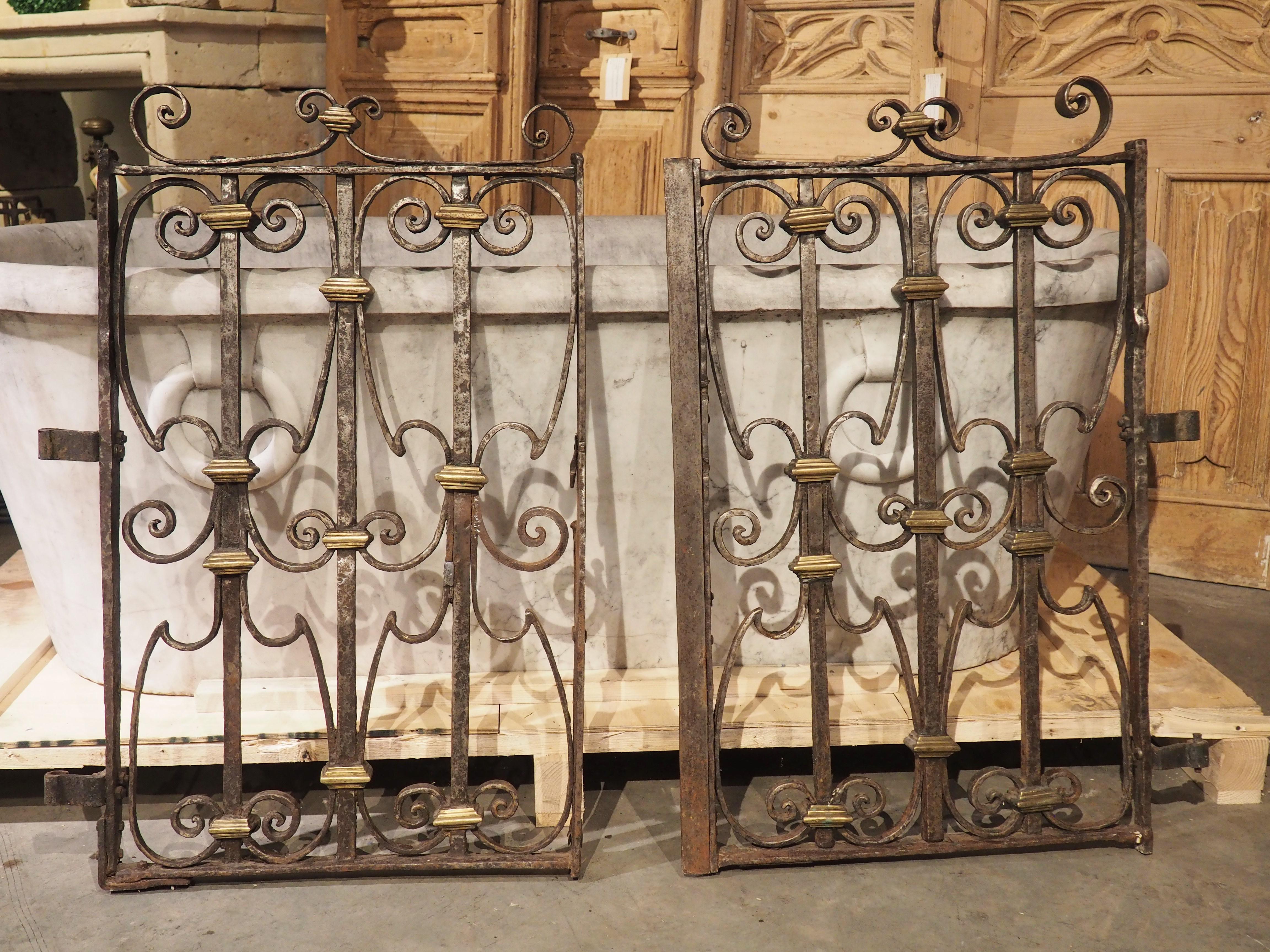 Dating back to the period of Louis XIV (mid- to late-1600’s), these scrolled forged iron gates with bronze dore embellishments were crafted in the French section of Basque Country. Le Pays Basque, as it is known in France, is a collection of regions