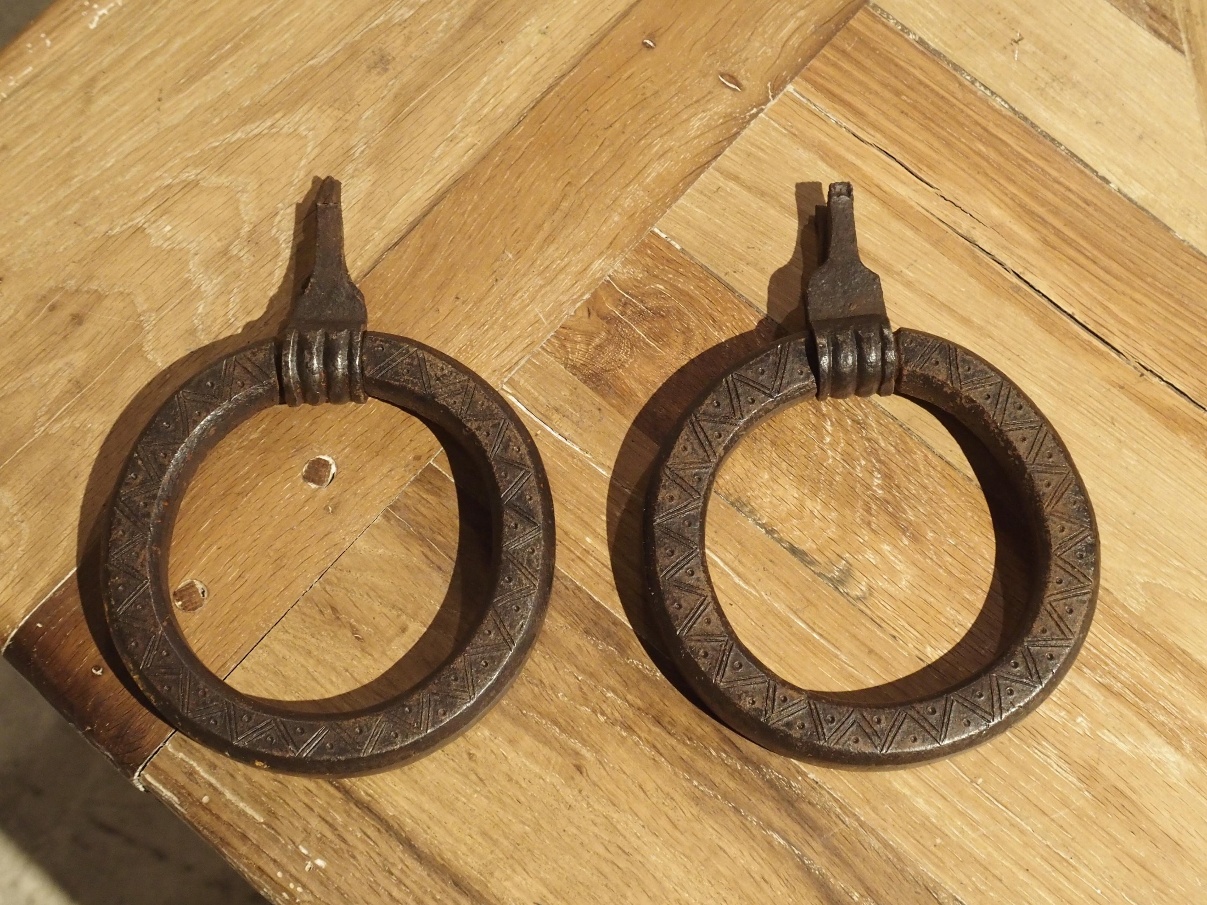This pair of hand forged door knockers may have been salvaged from a pair of exterior doors in the North of Italy. The simple iron ring knocker can often be seen on old farm doors throughout Tuscany. However, it’s also possible that these were horse
