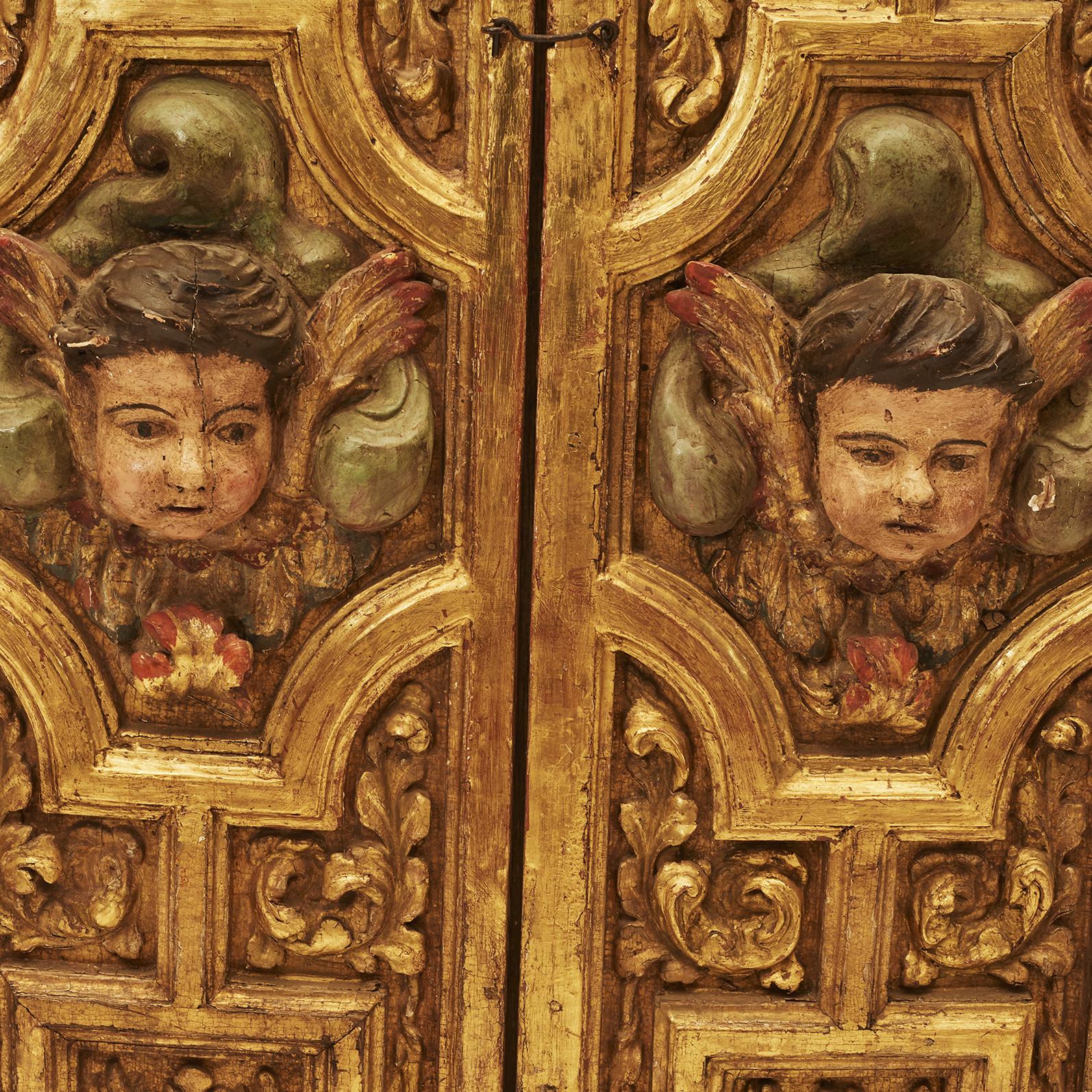 Pair of interior Baroque shutters. Wood carved, plated with putti heads in polychrome. Original condition. From Spanish castle.