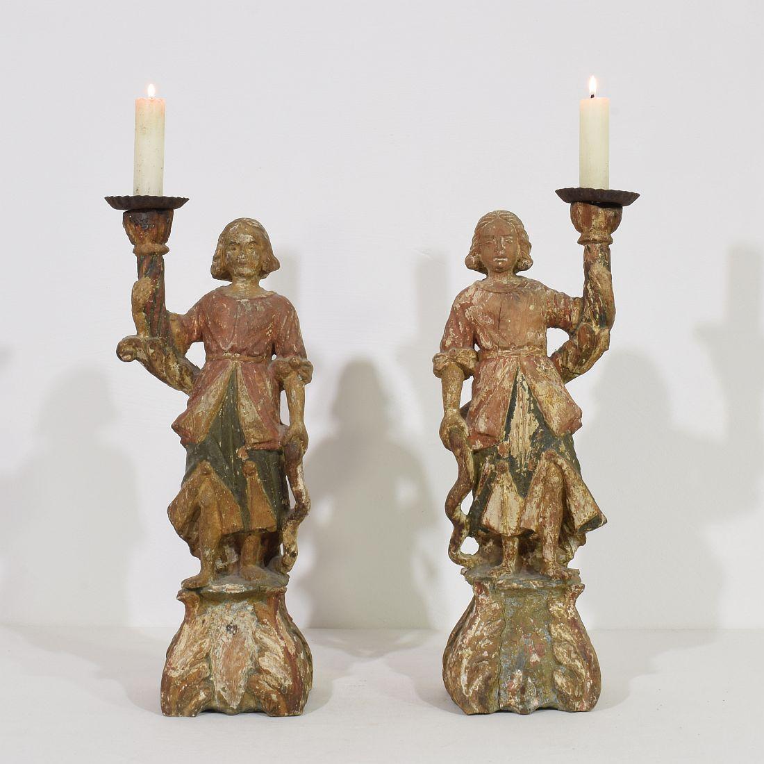 Wonderful pair of angelfigures with candleholders. Beautiful traces of the original paint visible, 
Italy, circa 1650-1700. Weathered, small losses
More pictures available on request.