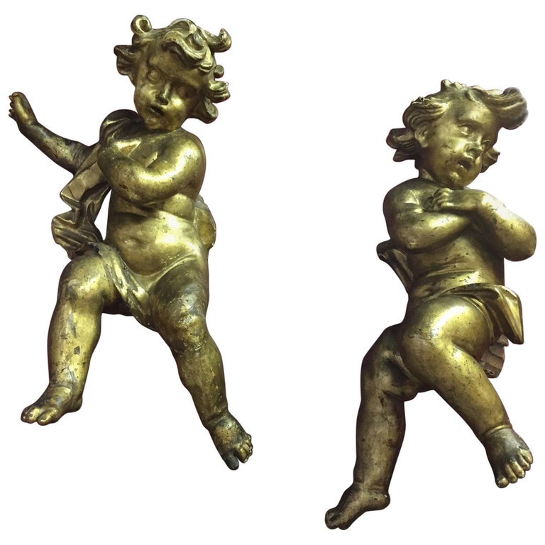 Pair of 17th Century Italian Baroque Giltwood Putti Figures For Sale