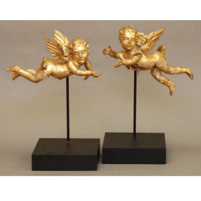 Found in an antiques market in Tuscany, this pair of gorgeous 17th century carved and gilded putti have been mounted on stands created for them by the stand makers of the Victoria and Albert Museum. These are unrestored, and have expected areas of