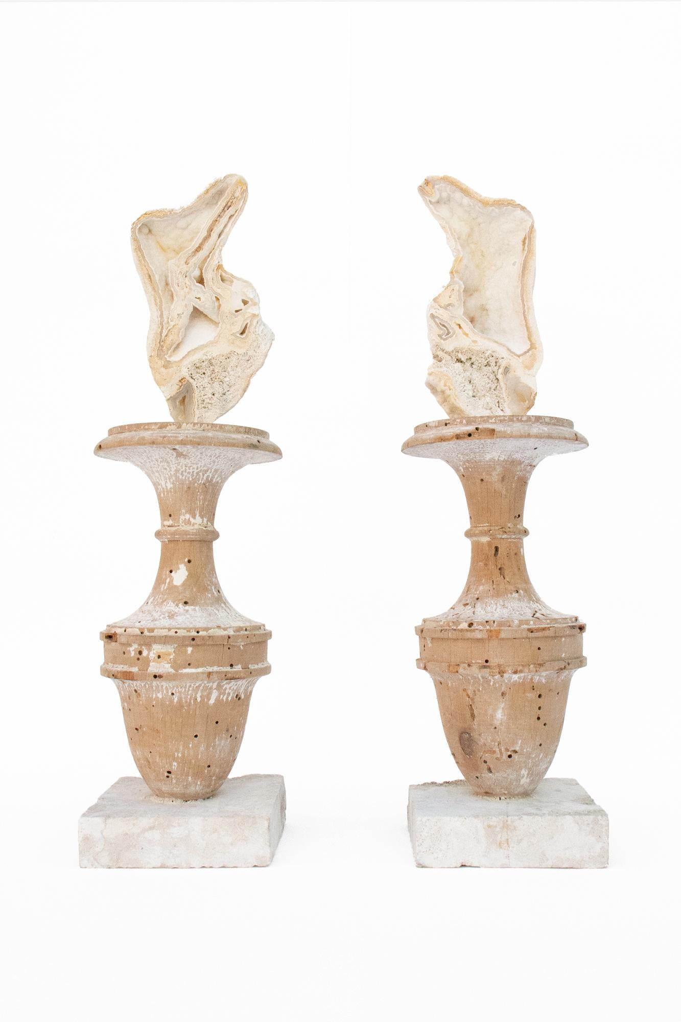 A pair of 17th century Italian fragment vases decorated with fossil agate coral on cut rock coral bases.

The pair is from a church in Florence. They were found and saved from the historic flooding of the Arno River in 1966. The pair of fossil agate