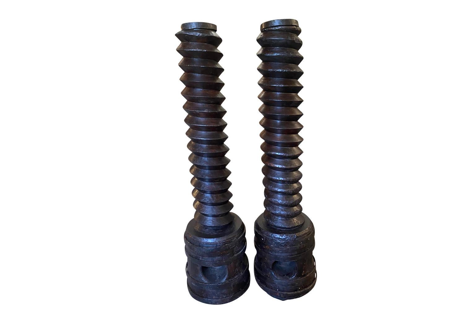 A fantastic pair of 17th century Wine Press Screws from the Tuscan region of Italy. Wonderfully carved from richly stained beech.  Terrific sculptures for a primitive or modern environment.