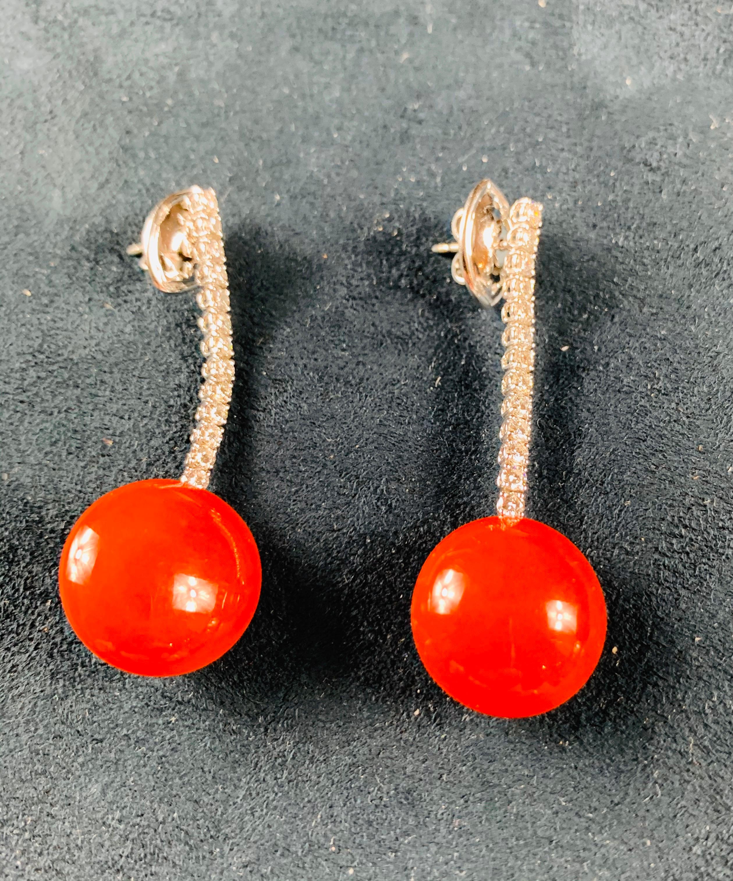 A Beautiful Very Rare And Elegant 18 Carat White Gold Pair Of Drop Red Coral Earrings With One Row Of Diamond Pave Claw Set .  ( 1 Carat GH-VS1)