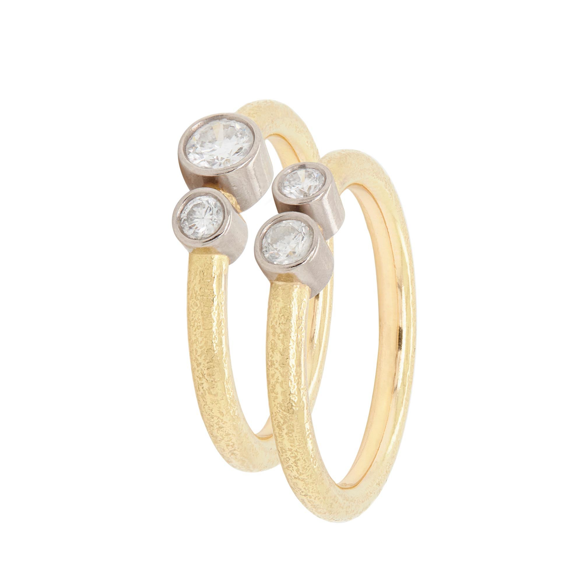Modern Pair of 18 Carat Yellow and White Gold Rub-Over Diamond Stacking Rings For Sale