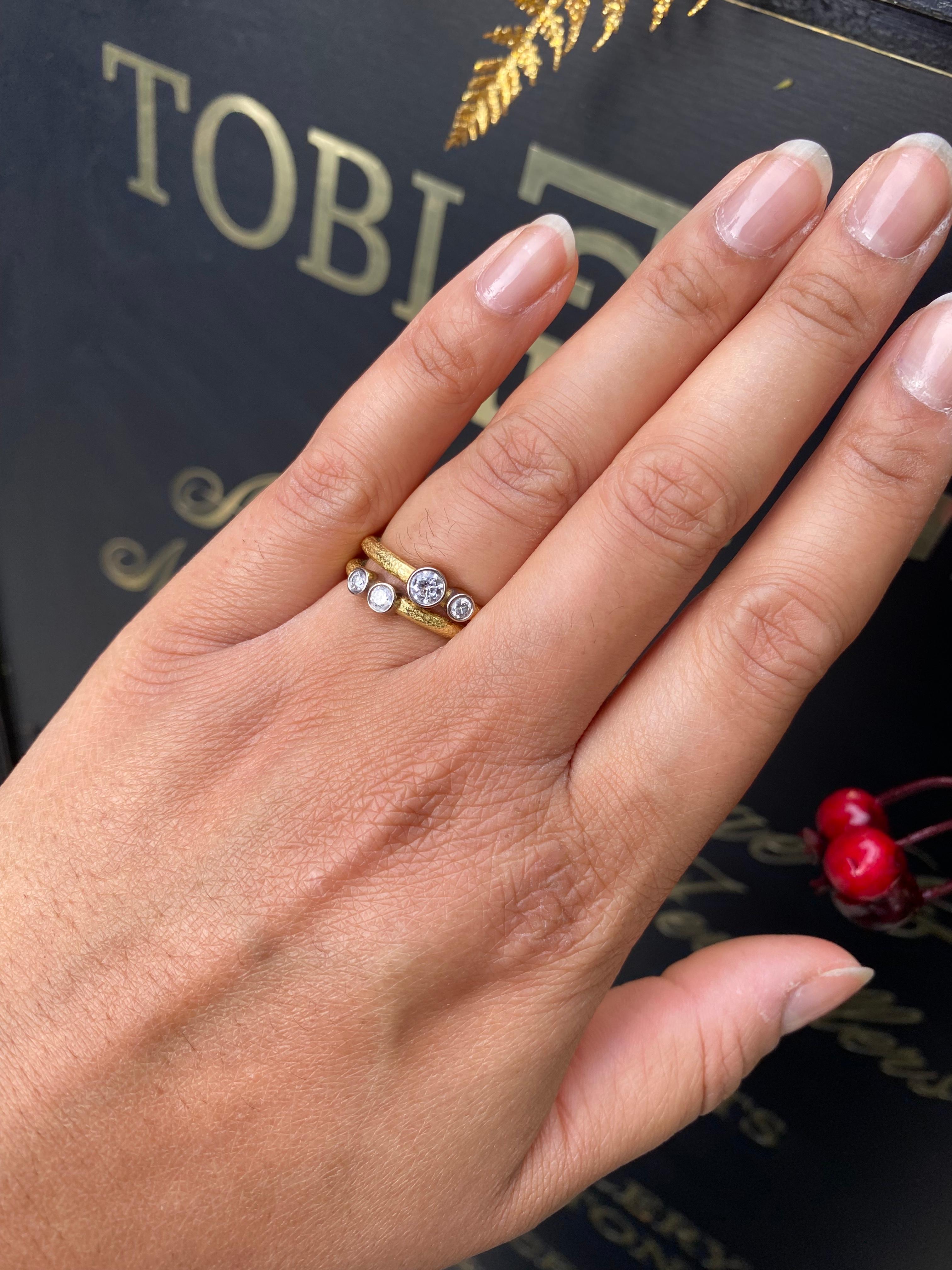Brilliant Cut Pair of 18 Carat Yellow and White Gold Rub-Over Diamond Stacking Rings For Sale