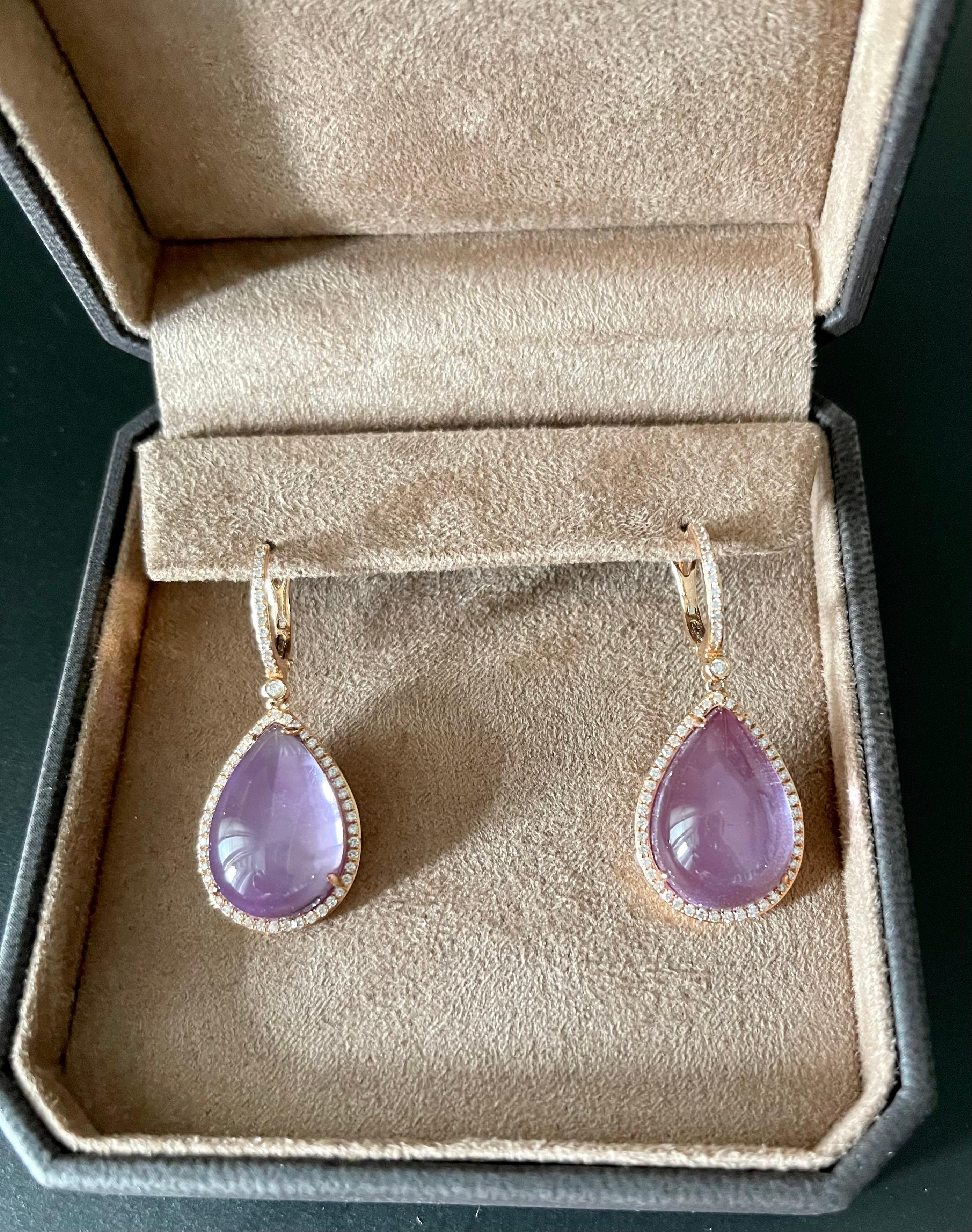 A pair of very elegant yet feminine earrings in 18 K rose Gold featuring a pear shape Amethyst top over a layer of mother of pearl surounded by 118 round brilliant cut Diamonds weighing 0.71 ct. This doublet consisting of mother of pearl and Quartz