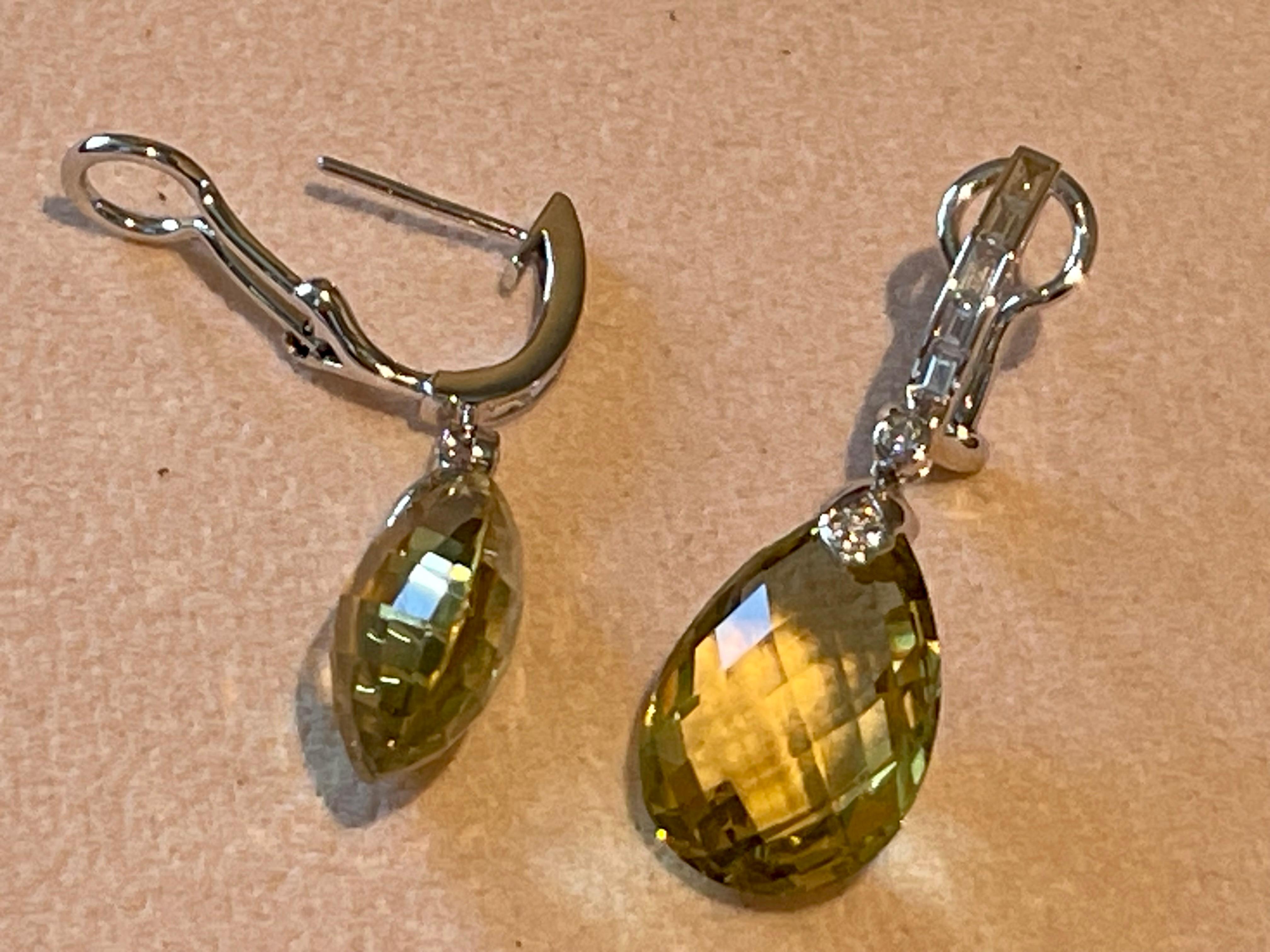 These Spectacular drop earrings are set with 2 stunning Briolette cut Lemon Quartz weighing 27.27 ct droppers which are a lovely clear lemon green colour and glisten beautifully in the light with many expertly cut facets that are truly magnificent.