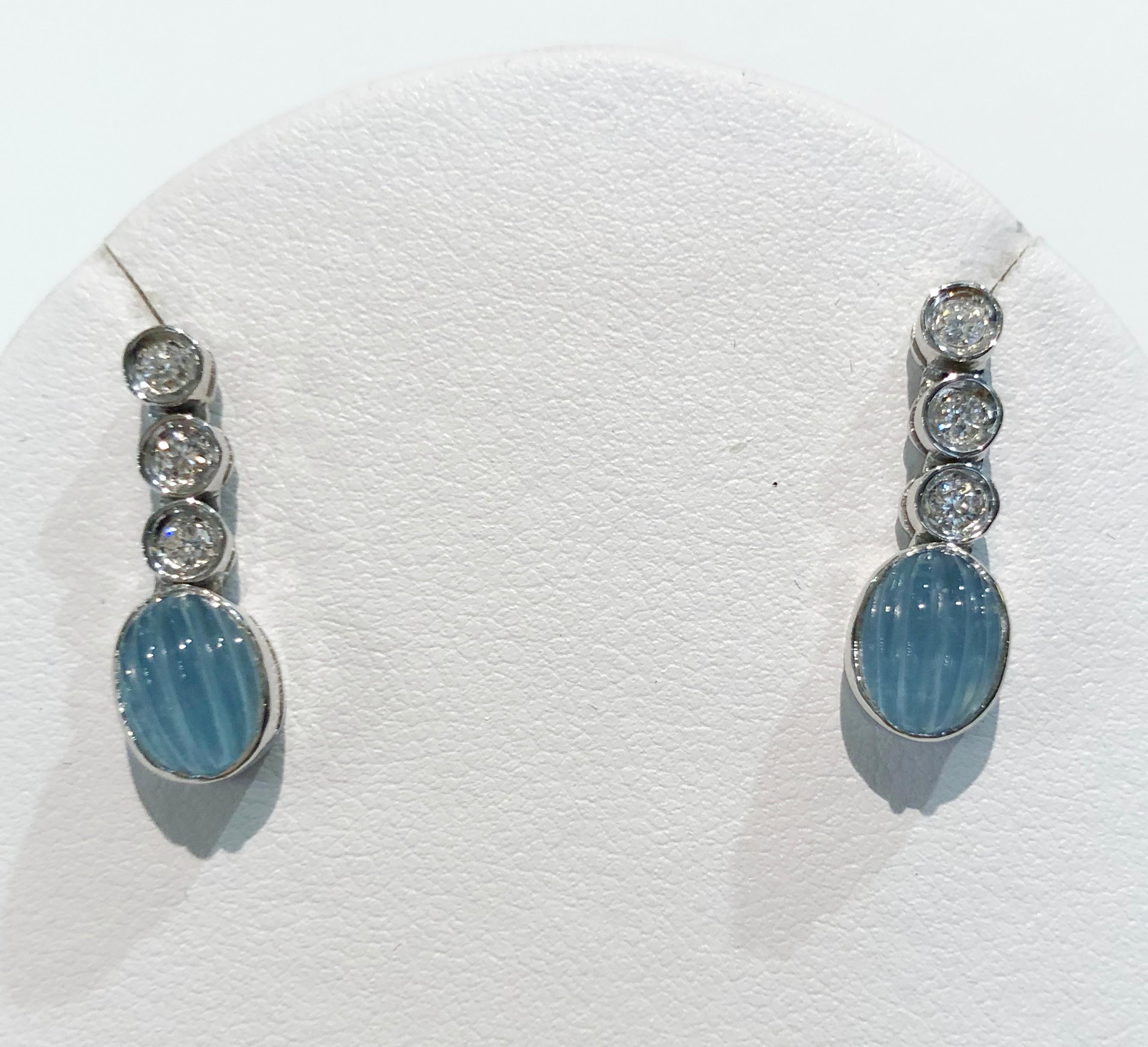 Pair of vintage earrings with 18 karat white gold, engraved aquamarine and brilliant diamonds, Italy 1970s
Length 2 cm