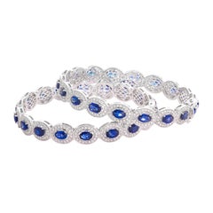 Pair of 18 Karat White Gold Blue Sapphire Diamond Bangle Bracelets