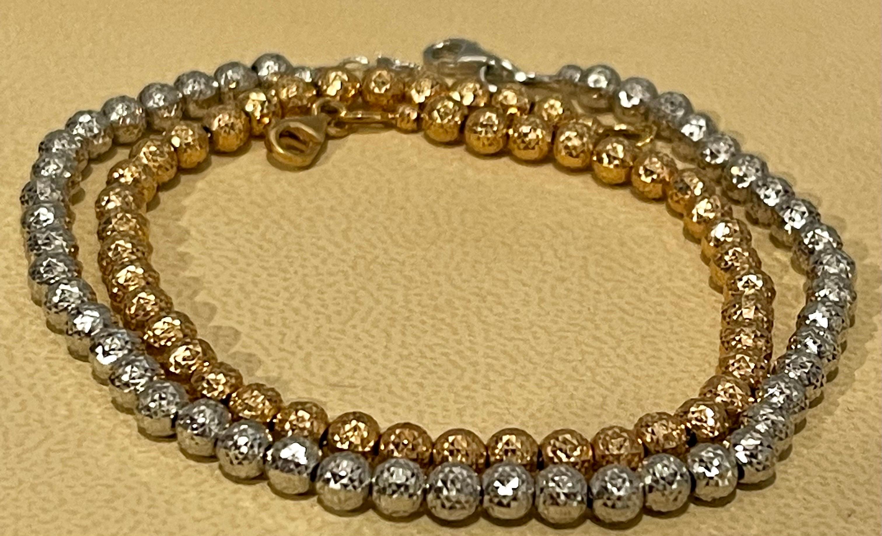 very fashionable , Beaded bracelet 
Pair of 18 Karat White Gold/ Rose Gold Ball Bracelets, 8.2 Gm, Length 7.5 Inch
Two Bracelet , one in White gold and one in Rose gold
each 7.0 Inches long bracelet
Beautiful ball design and lobster clasp
Weight of