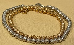 Pair of 18 Karat White Gold/ Rose Gold Ball Bracelets, 8.2 Gm