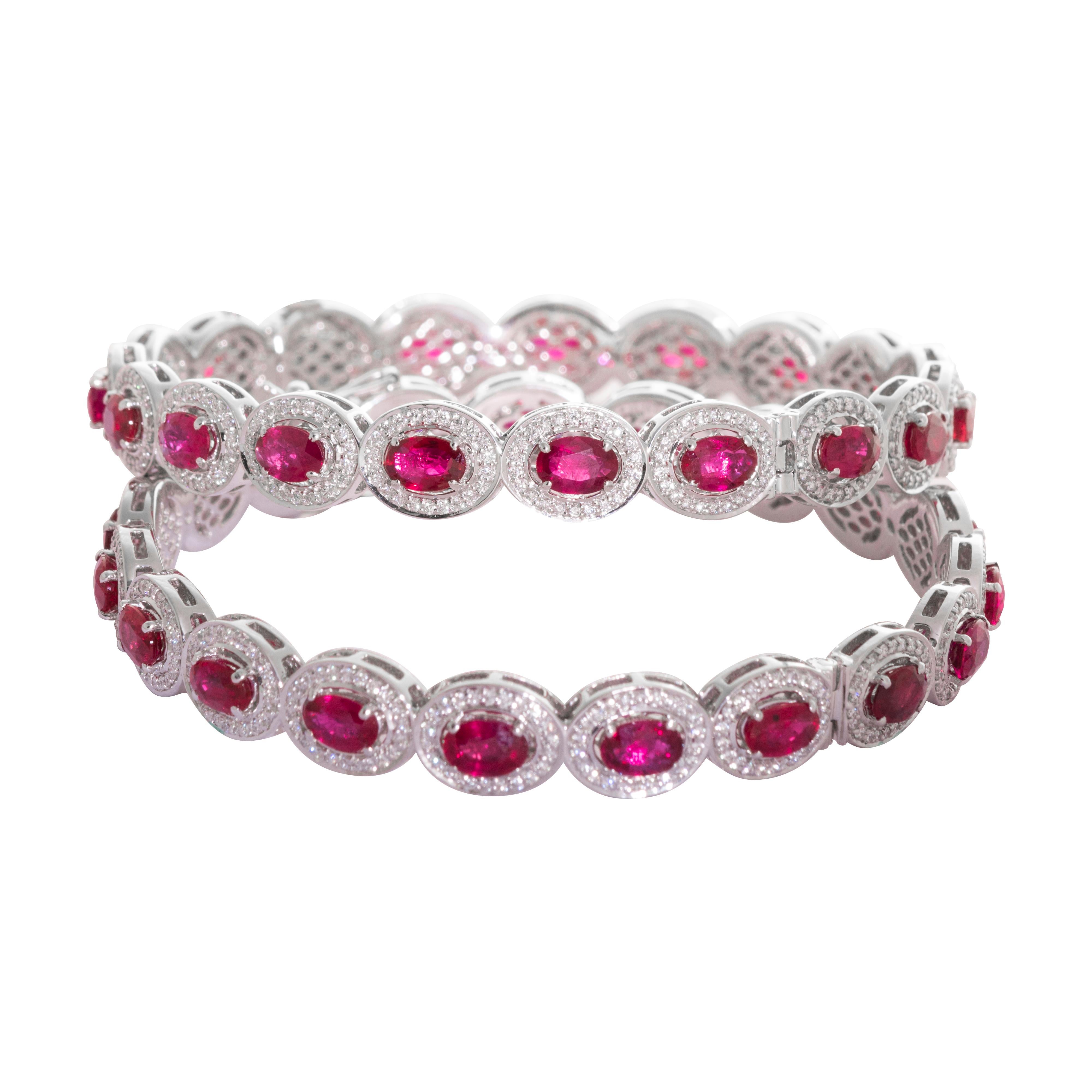 Pair of 18 Karat White Gold Ruby Diamond Bangle Bracelets

Set in 18 Karat white gold and studded with white diamonds (VVS Purity) and beautiful red rubies, these bangle bracelets are perfect for evening wear.

The bangle diameter is 2.37 inches but