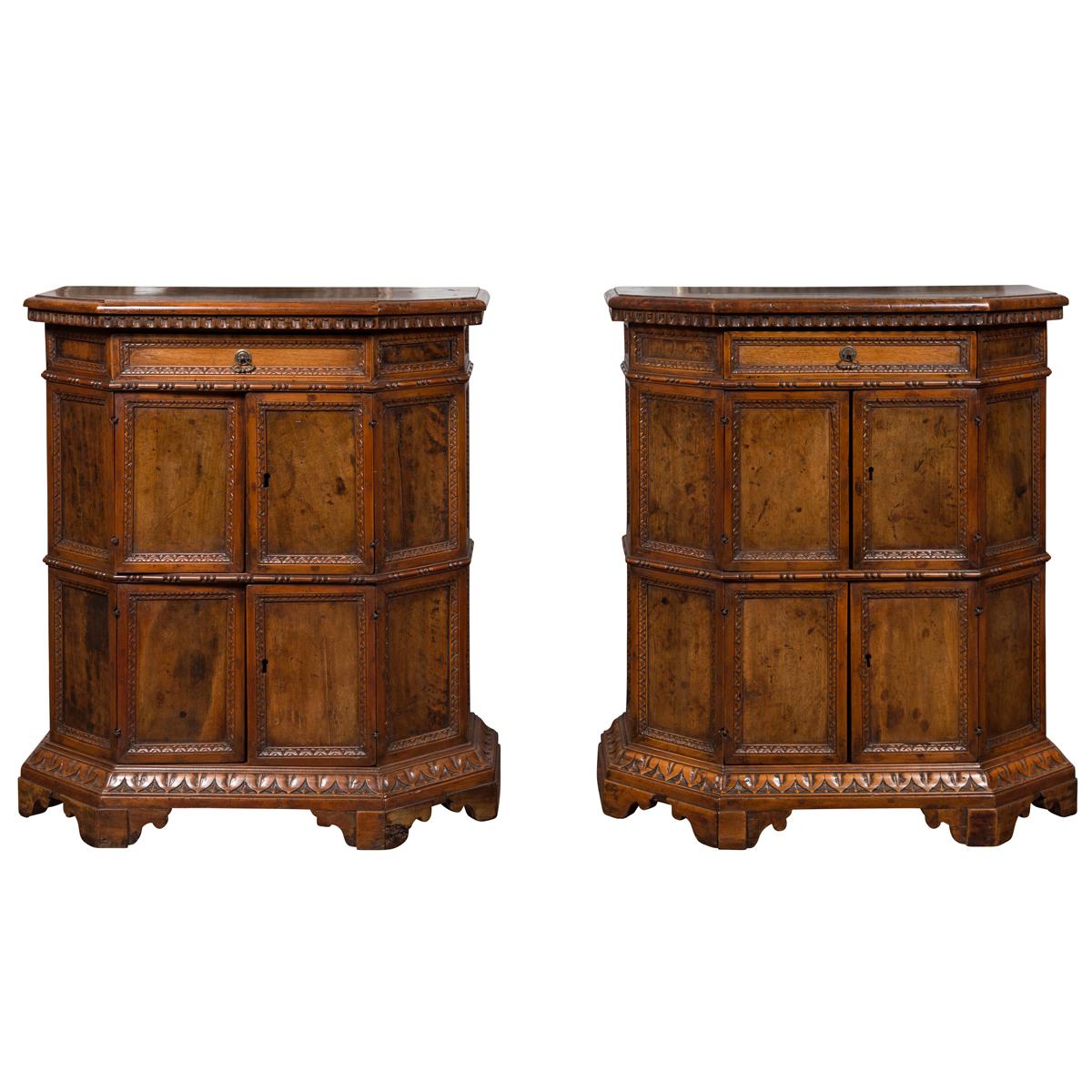 Pair of 1800s Italian Carved Walnut Cabinets with Canted Sides, Drawer and Doors