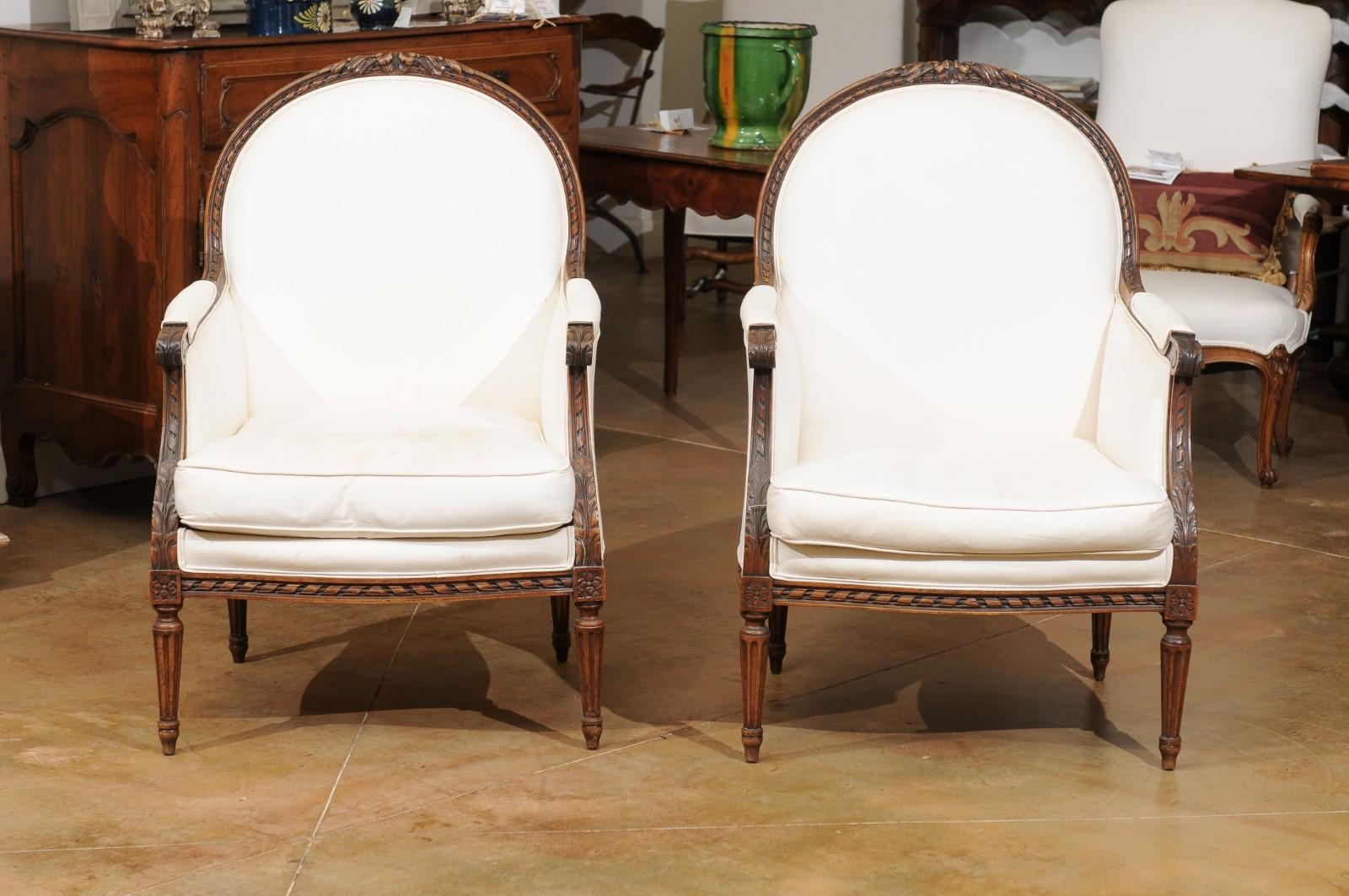 Pair of 1830s French Restauration Carved Walnut Upholstered Bergères Chairs 7