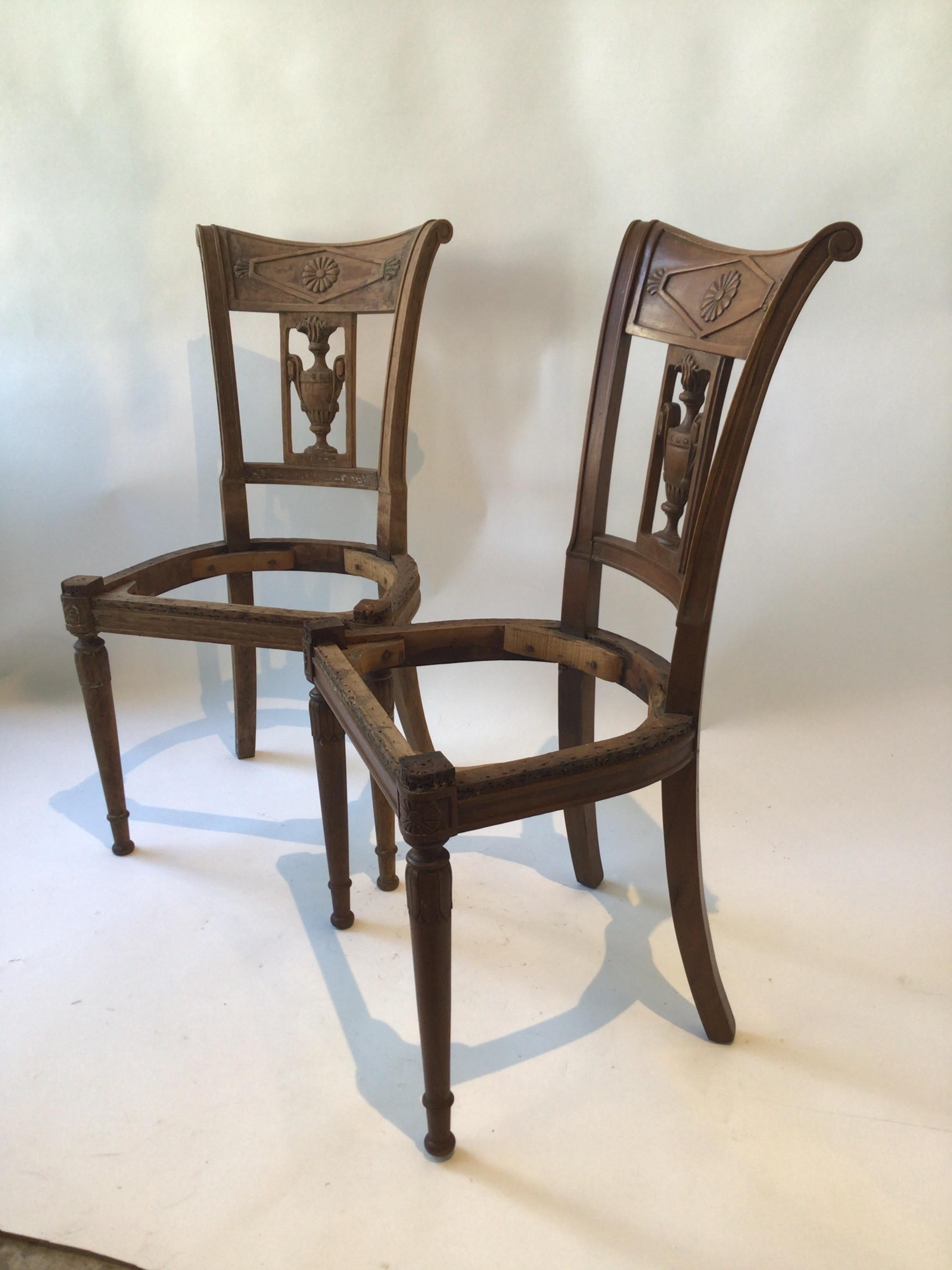 Pair of 1850s French Empire side chairs. Hand carved.