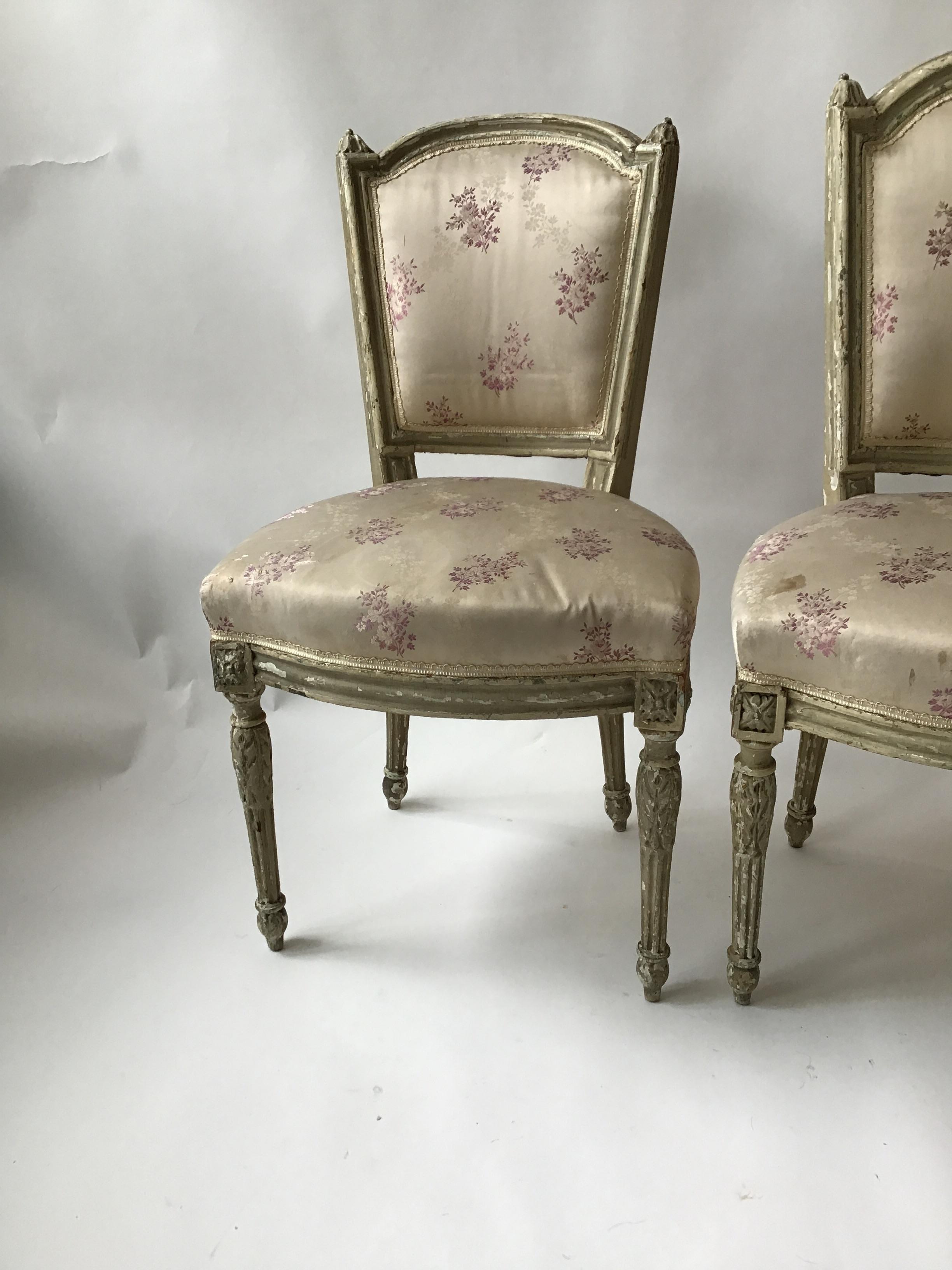 Pair of 1870s French Louis XVI side chairs. One chair is taller than the other. The taller one was for the man, the shorter, for the woman.