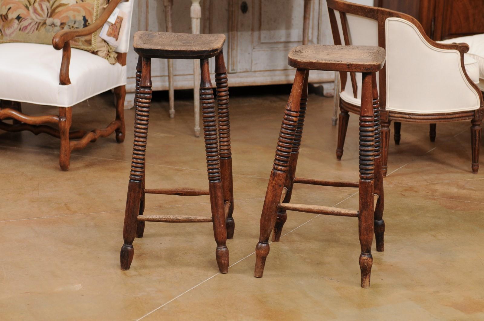 Pair of 1870s French Wooden Bar Stools with Spool Legs and Weathered Patina In Good Condition In Atlanta, GA