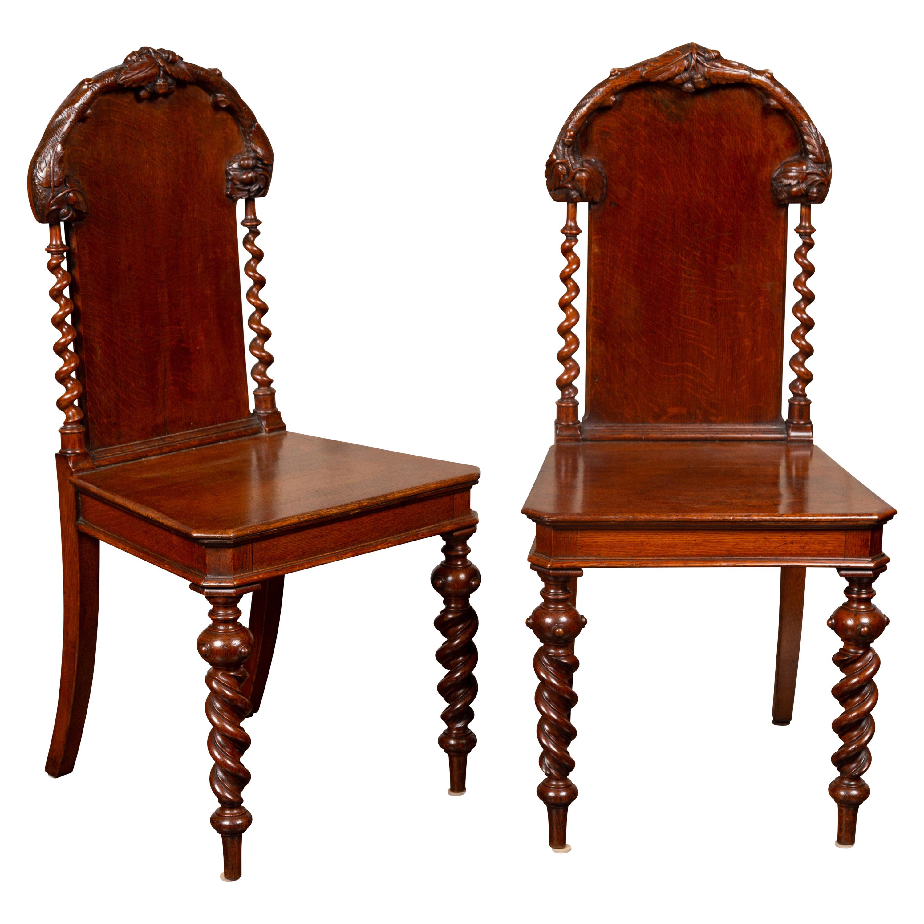 Pair of 1880s English Barley Twist Oak Hall Chairs with Foliage and Acorn Motifs