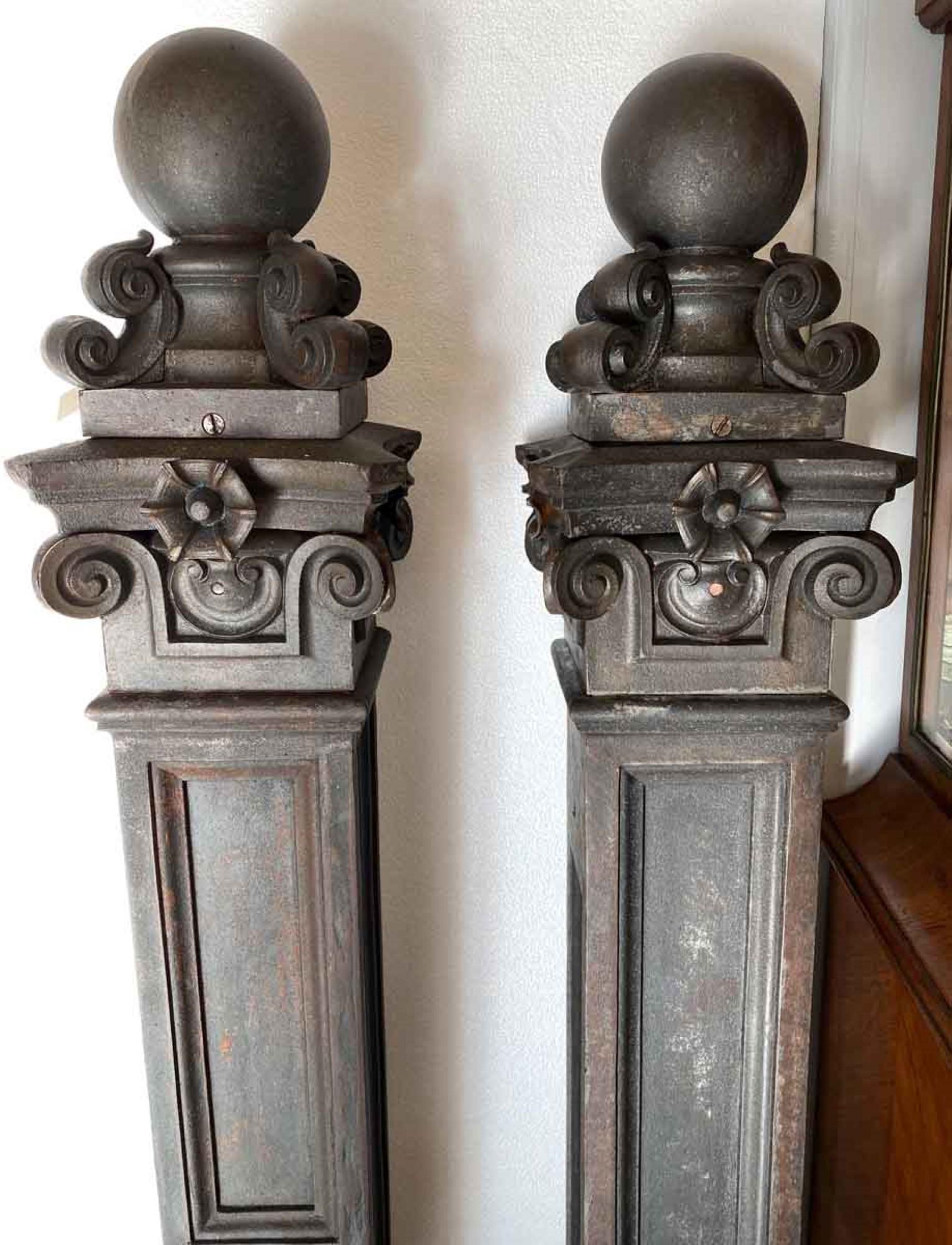 Spectacular pair of decorative cast iron newel posts from a late 1800s brownstone in Brooklyn, NY. Very heavy cast iron with ball finials. These feature details of scrolls and flowers tops. Small quantity available at time of posting. Please