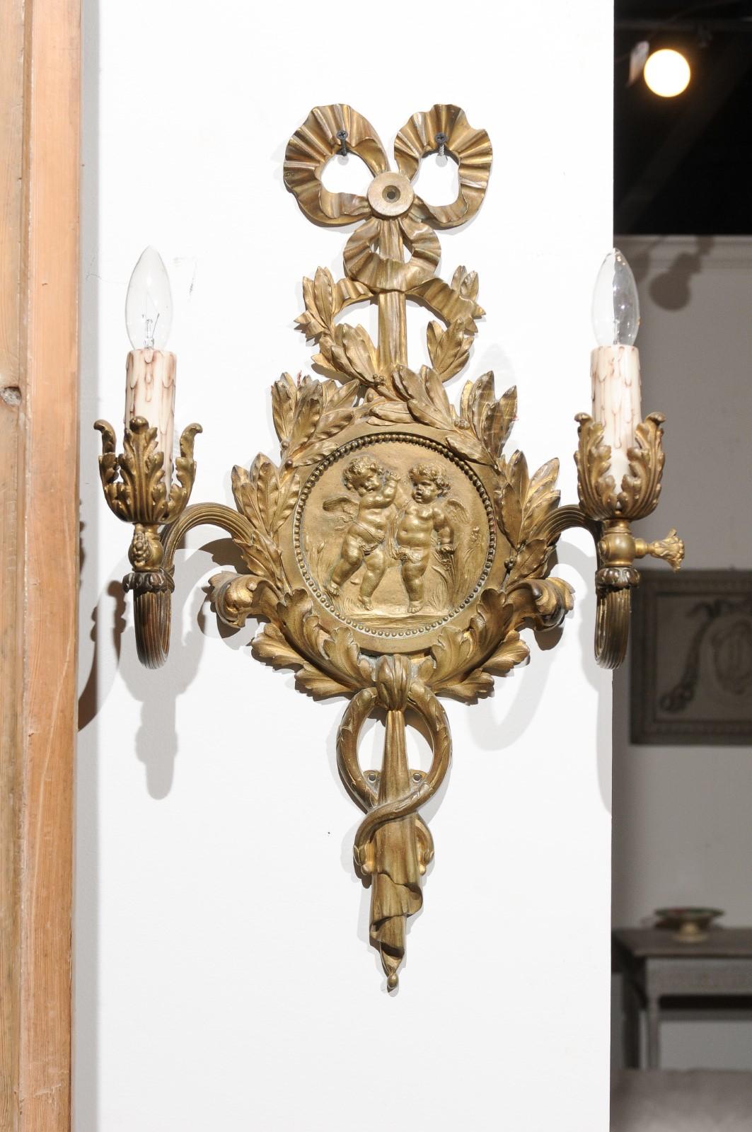 Pair of 1890s French Two-Light Brass Sconces with Ribbon, Cherubs and Satyrs In Good Condition For Sale In Atlanta, GA