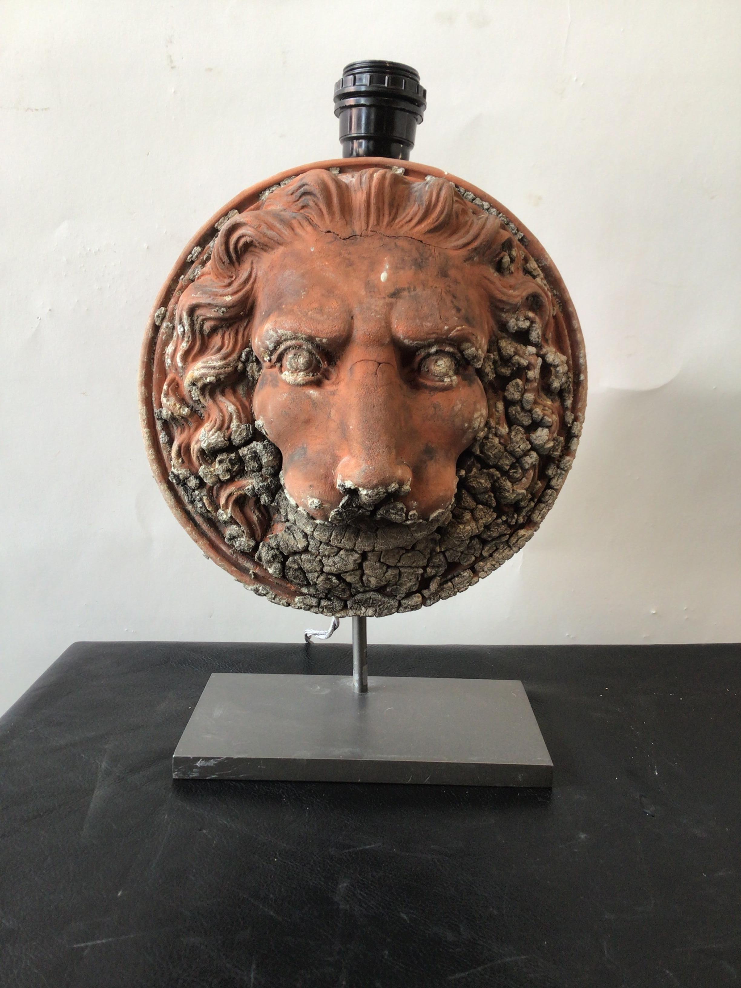 Pair of custom made terracotta lion lamps made from architectural pieces off of a London building. From a Southampton, NY estate.