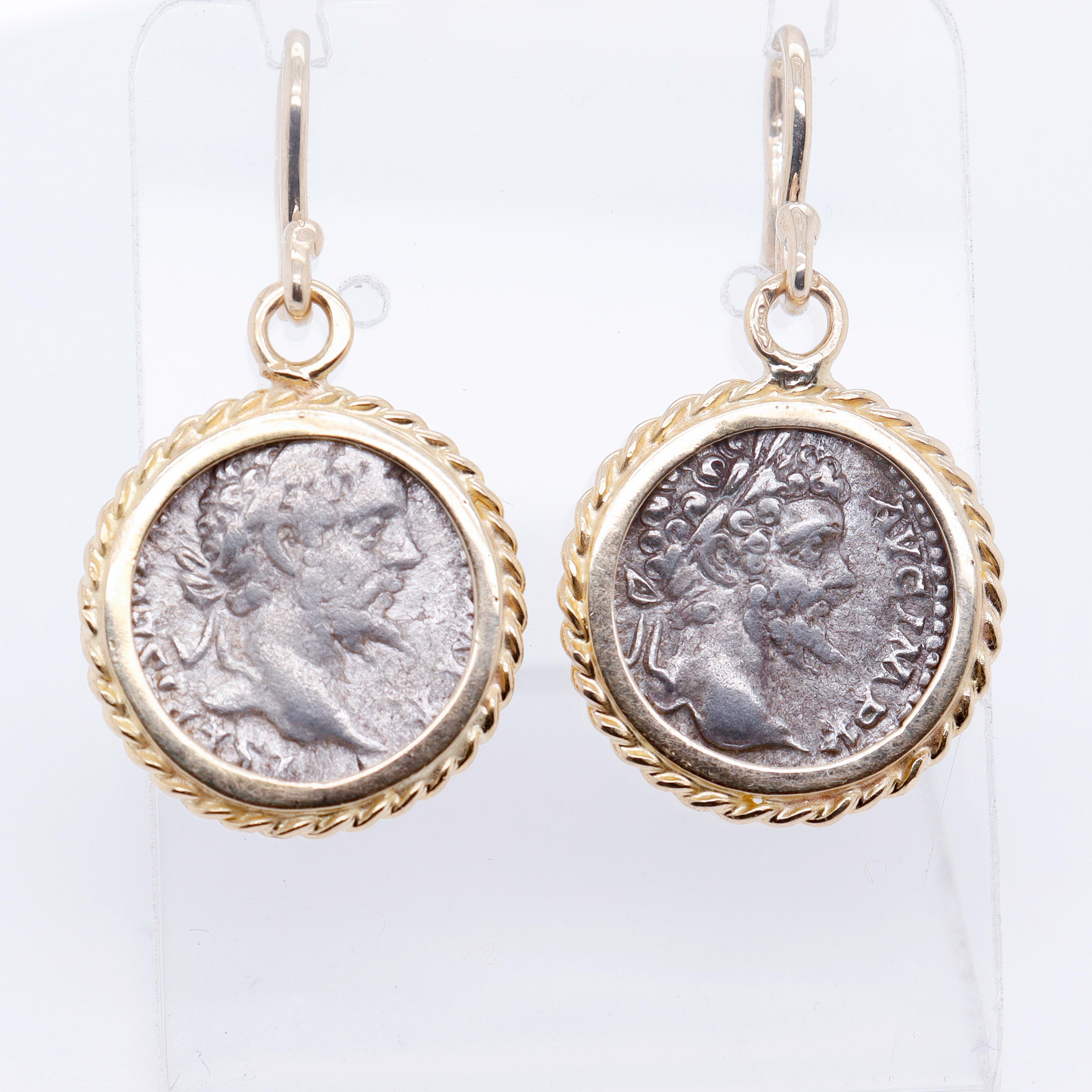 A fine pair of ancient Roman coin earrings.

Set in 18k gold.

With omega shaped ear wires and a rope-twist bezel setting for the coins.

Each coin is a silver Marcus Aurelius denarius (ca. 100-200 CE). 

With Aurelius' face to the obverse of each.