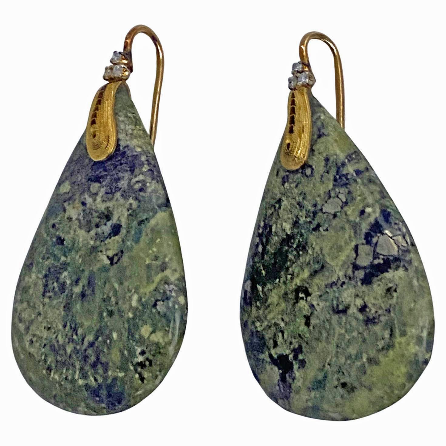 Pair of 18K green Agate and Diamond drop Earrings. Each suspending a polished large pear shape green agate with mottled with black and white coloring. The 18K gold surmounts of an etruscan swirl design, each with three small full cut diamonds.