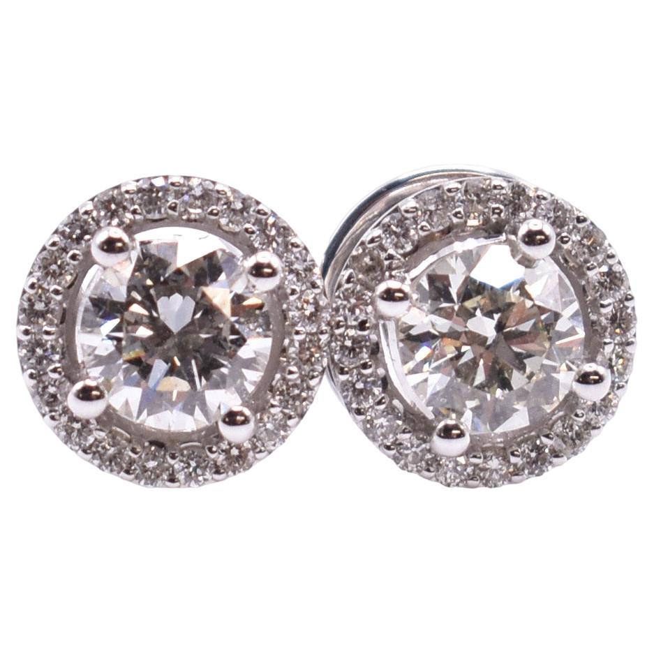 Pair of 18k White Gold 1.18 Carat Diamond Halo Stud Earrings For Sale