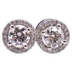 Pair of 18k White Gold 1.18 Carat Diamond Halo Stud Earrings