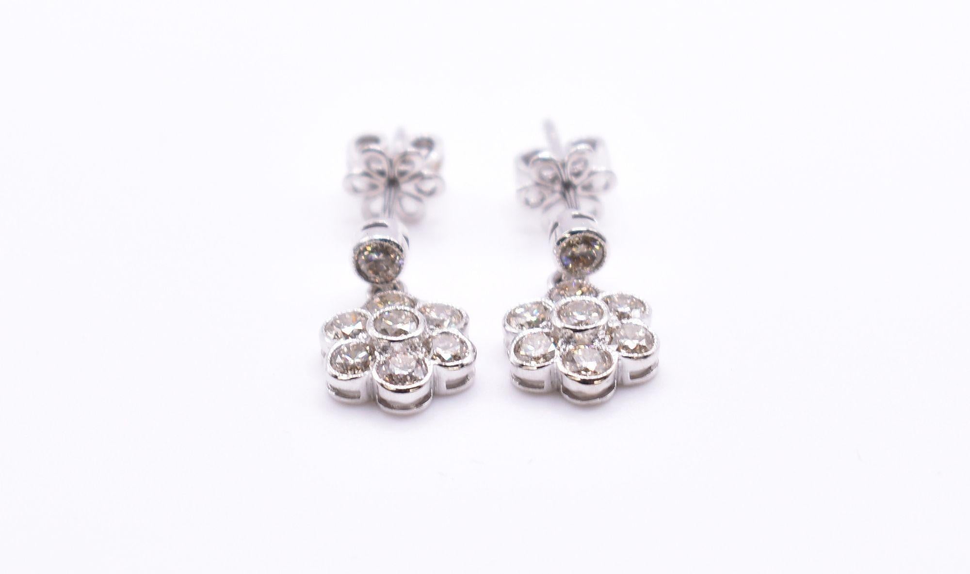 For sale is a fabulous pair of 18k white gold, 1.40ct diamond daisy drop earrings, comprising a total of 16 diamonds. Diamond weight: 1.40ct. VS-SI clarity, J/K Colour Total weight: 3.5g.

RRP: £2,500